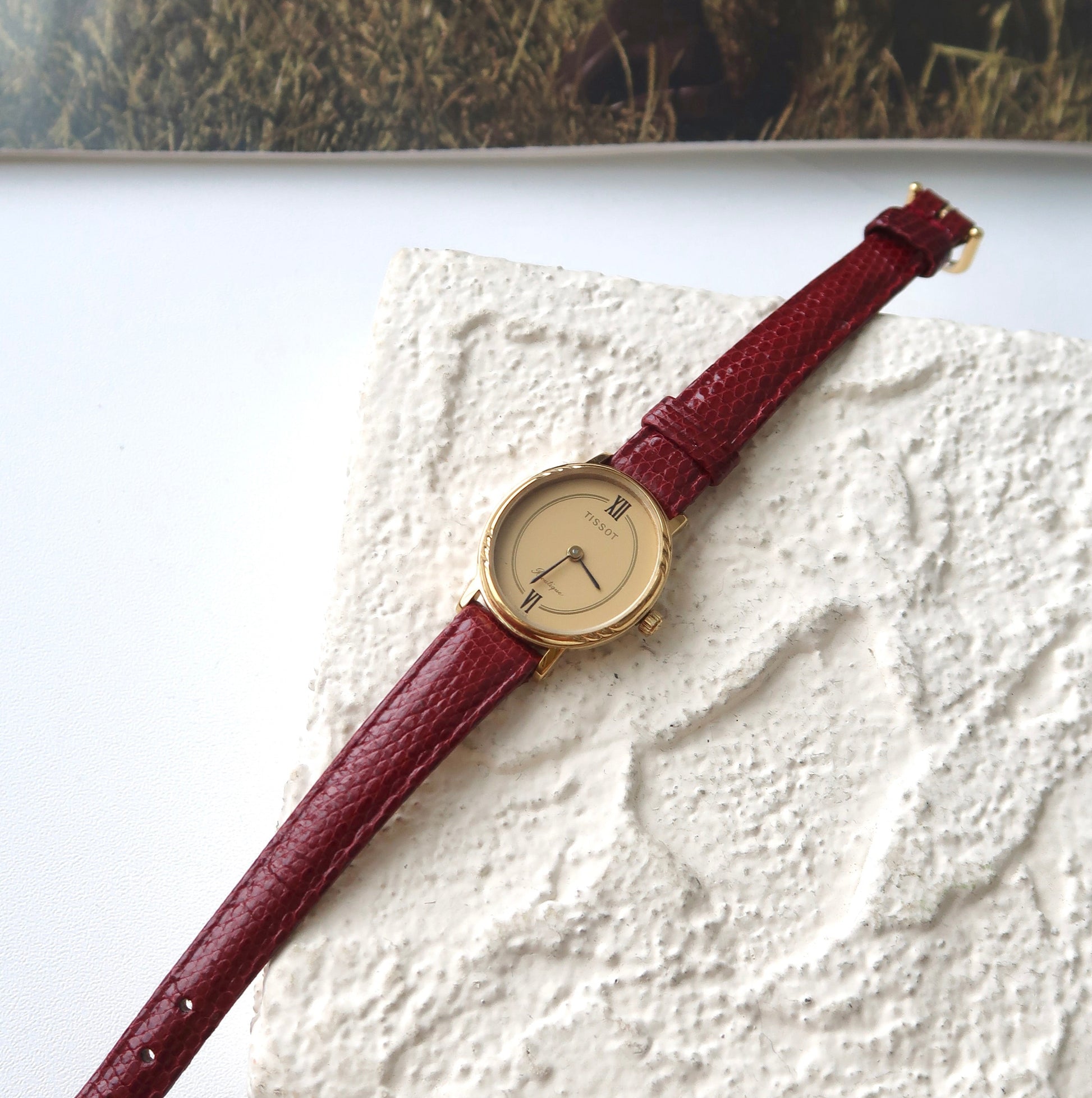 T. Boutique Oval Gold Dial with Dark Red Strap Watch