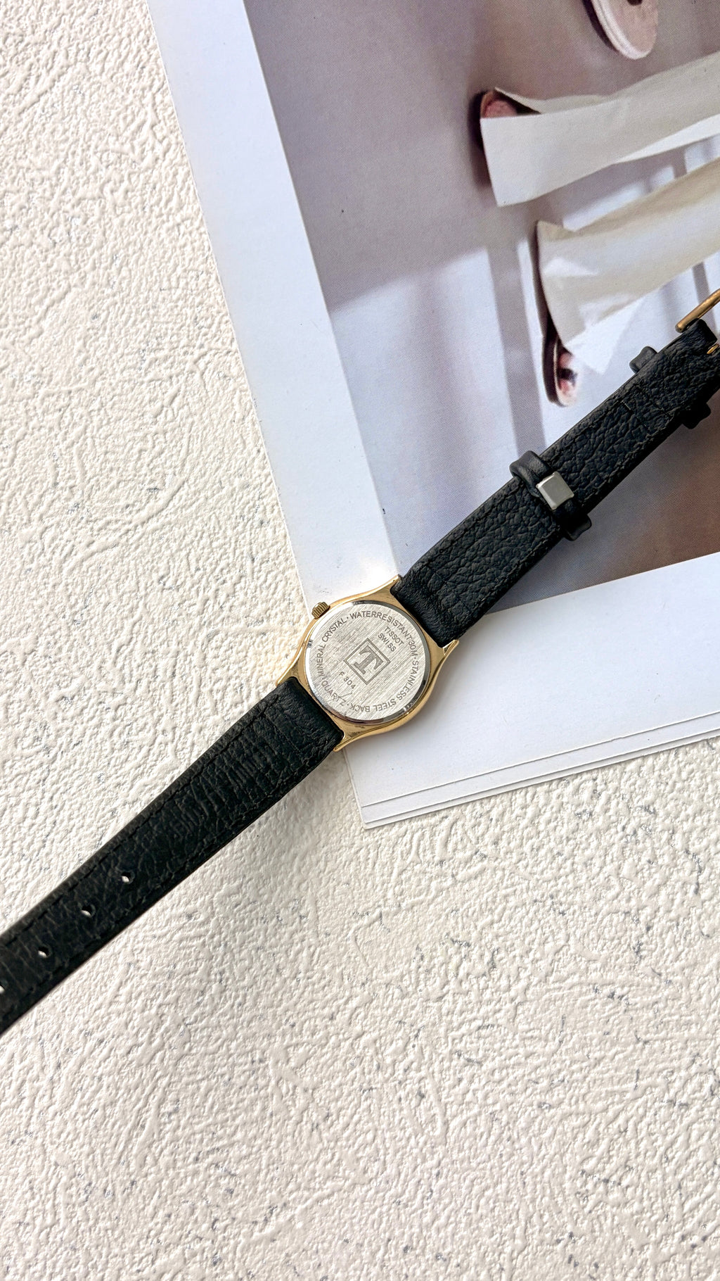 T. Stylist Gold Round Date Dial Black Strap Watch