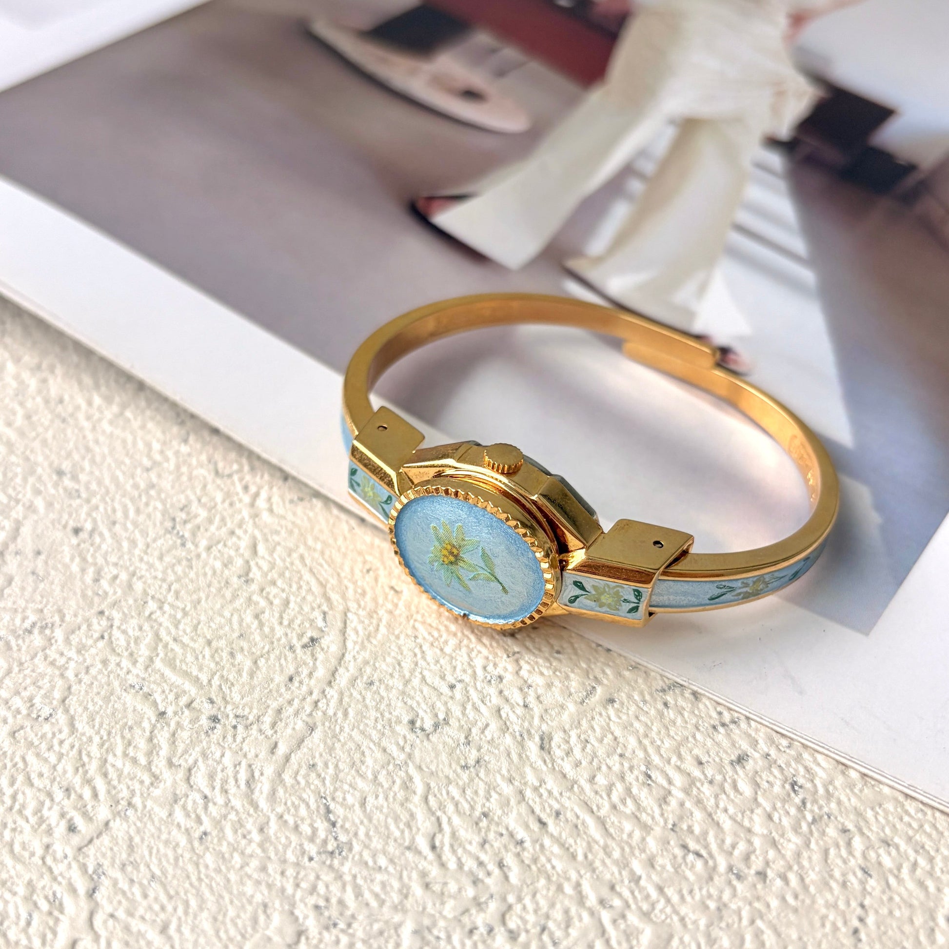 AM. Blue Flower Pattern Gold Bangle Watch