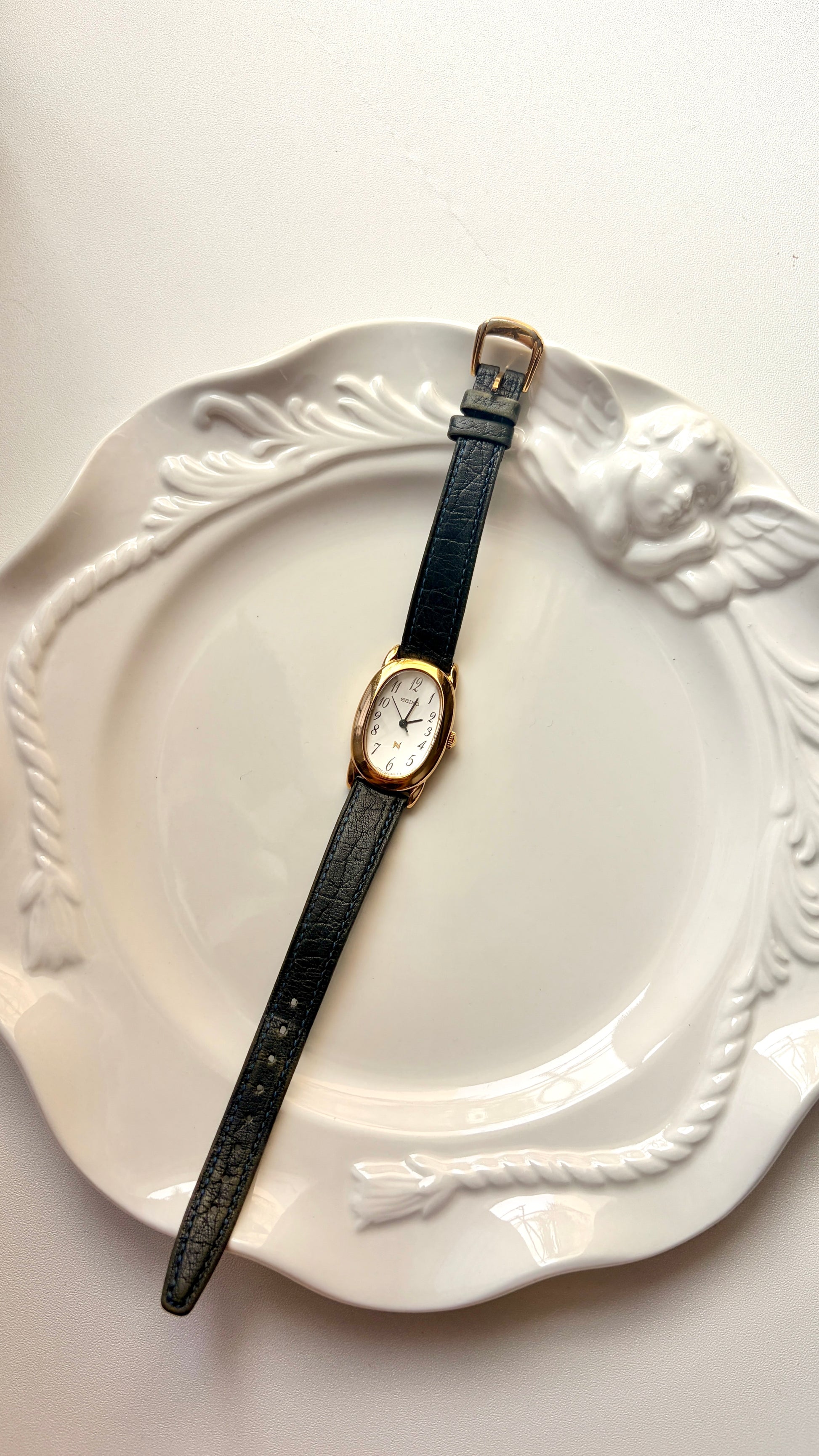 S. Noie White Oval Dial Black Strap Watch