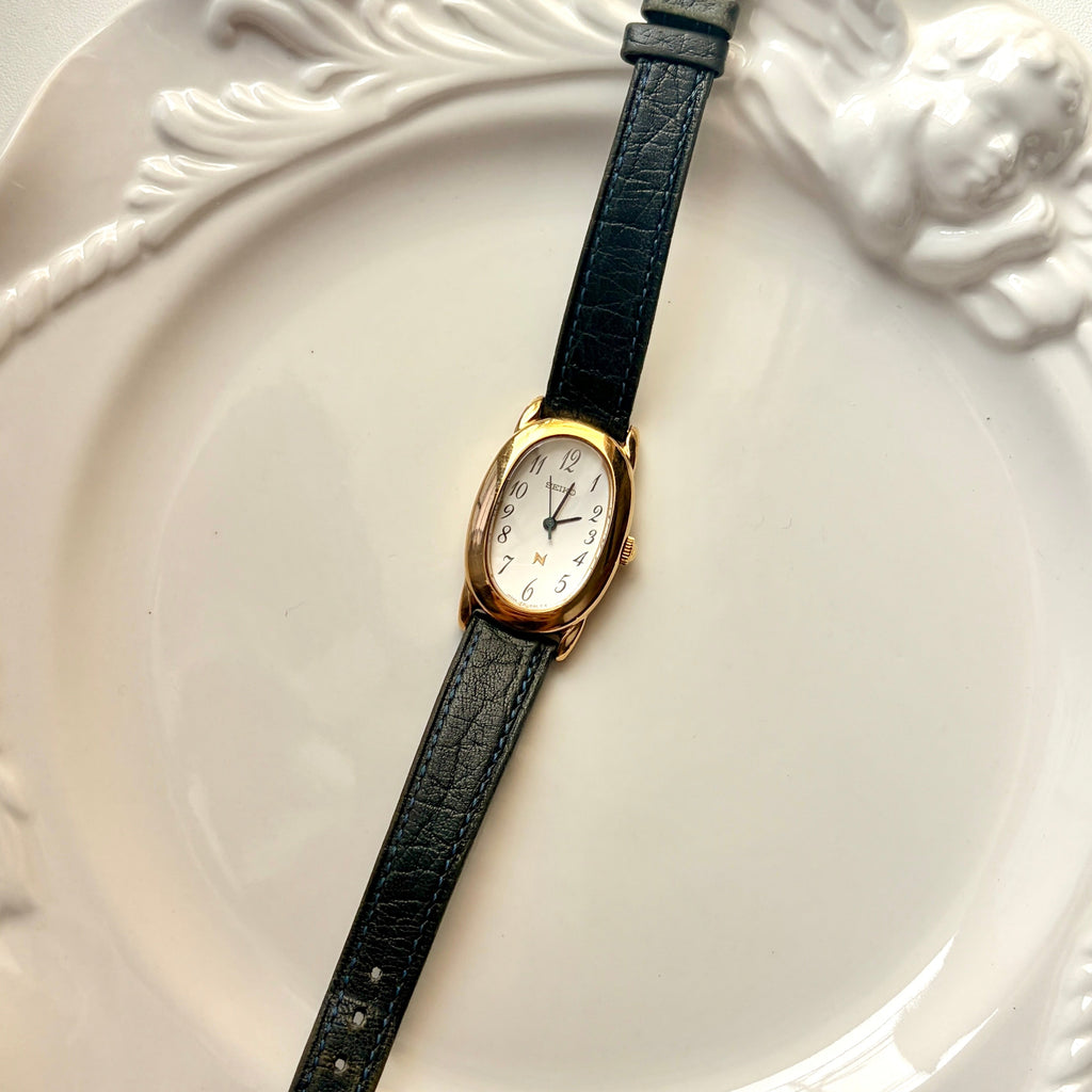 S. Noie White Oval Dial Black Strap Watch