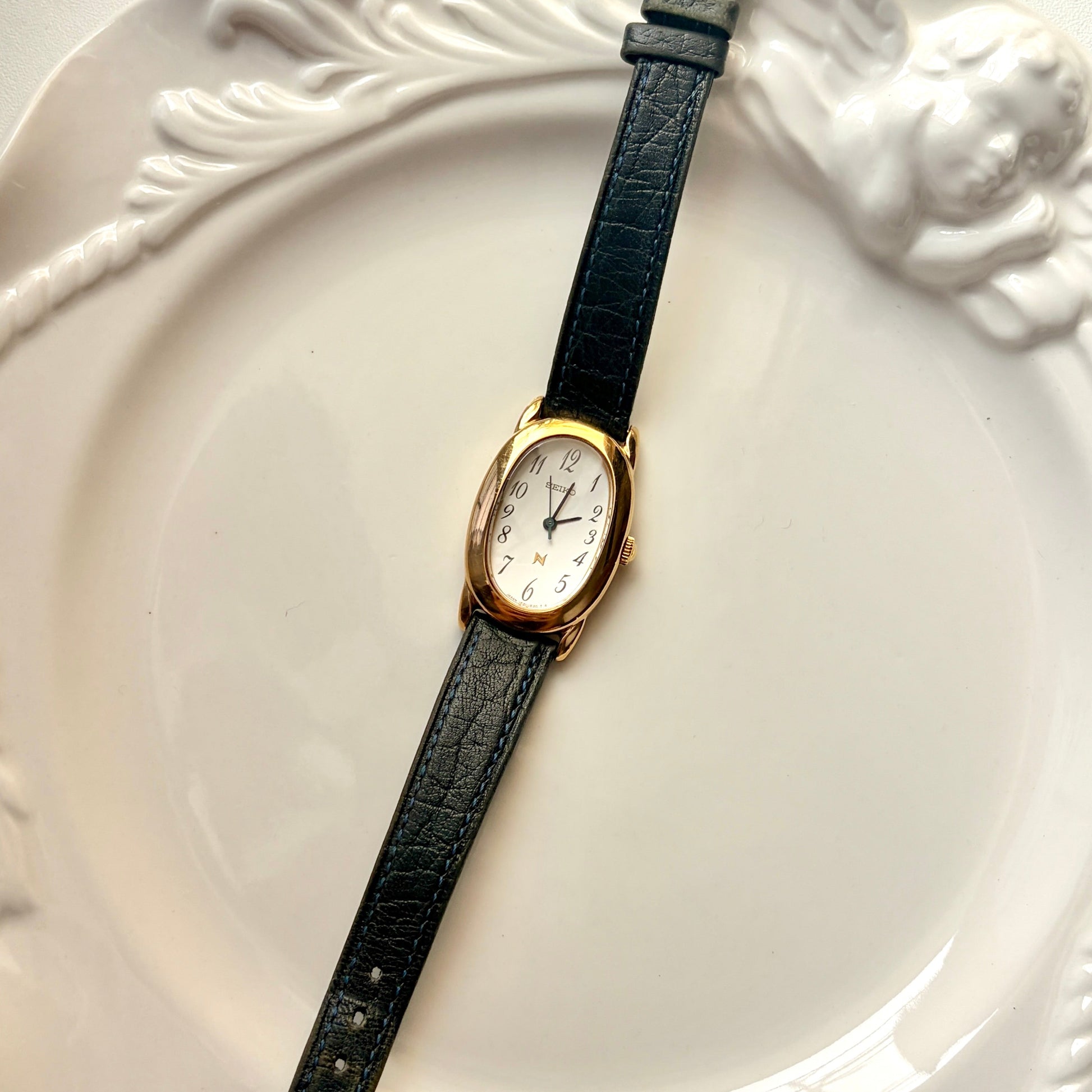 S. Noie White Oval Dial Black Strap Watch