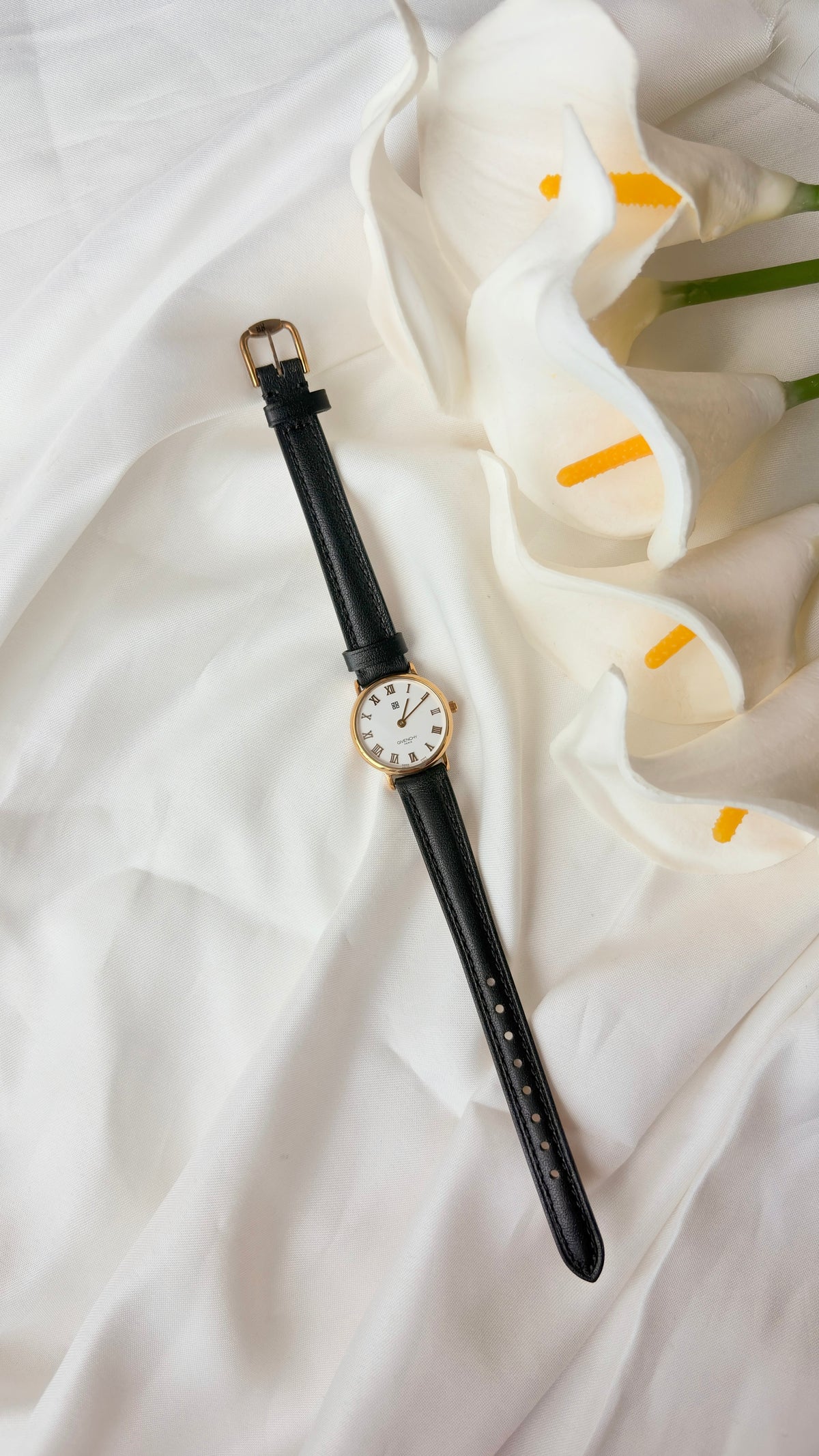 GV. White Round Roman Dial Black Strap Watch
