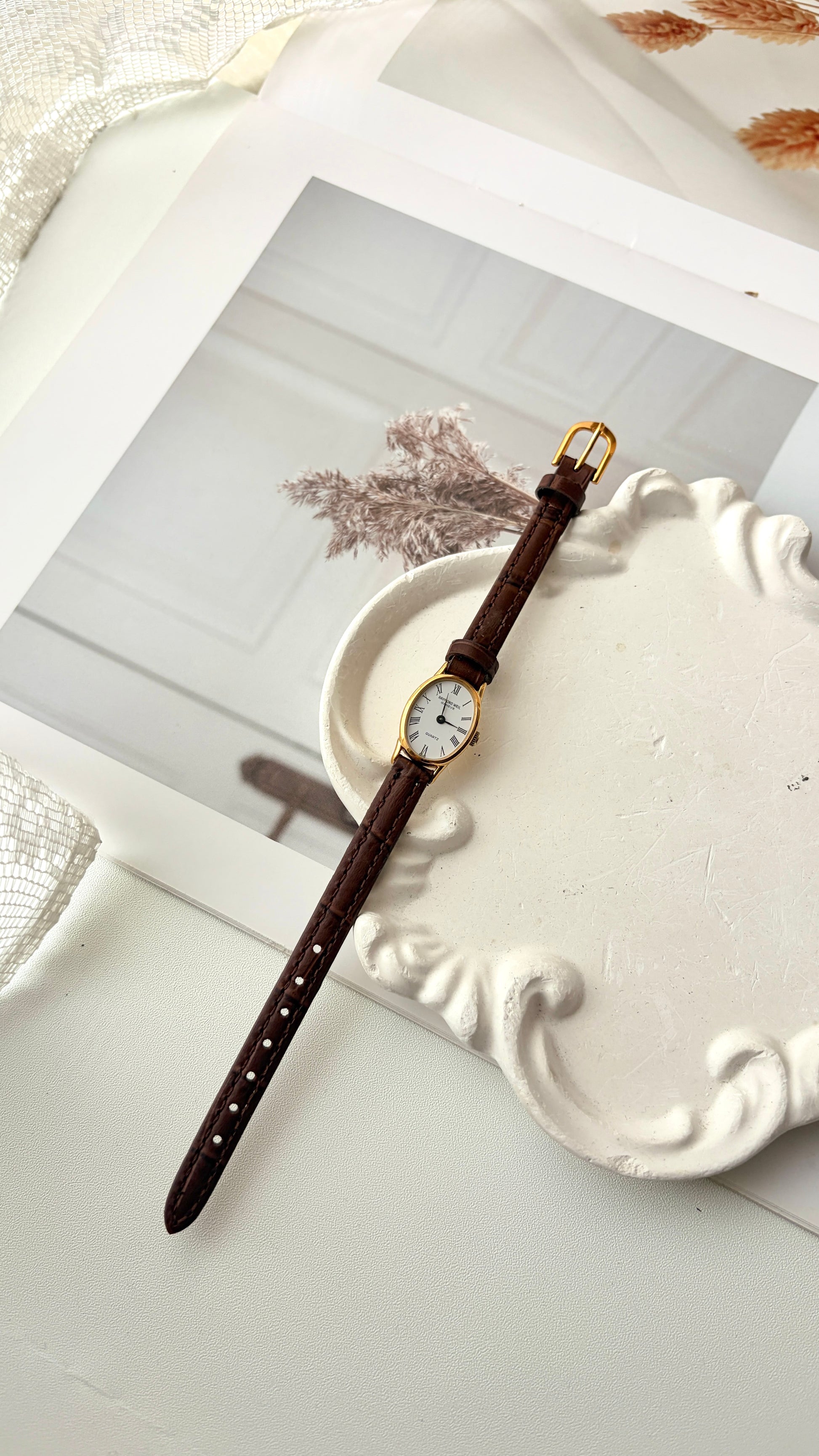 RW. White Oval Dial Brown Strap Watch