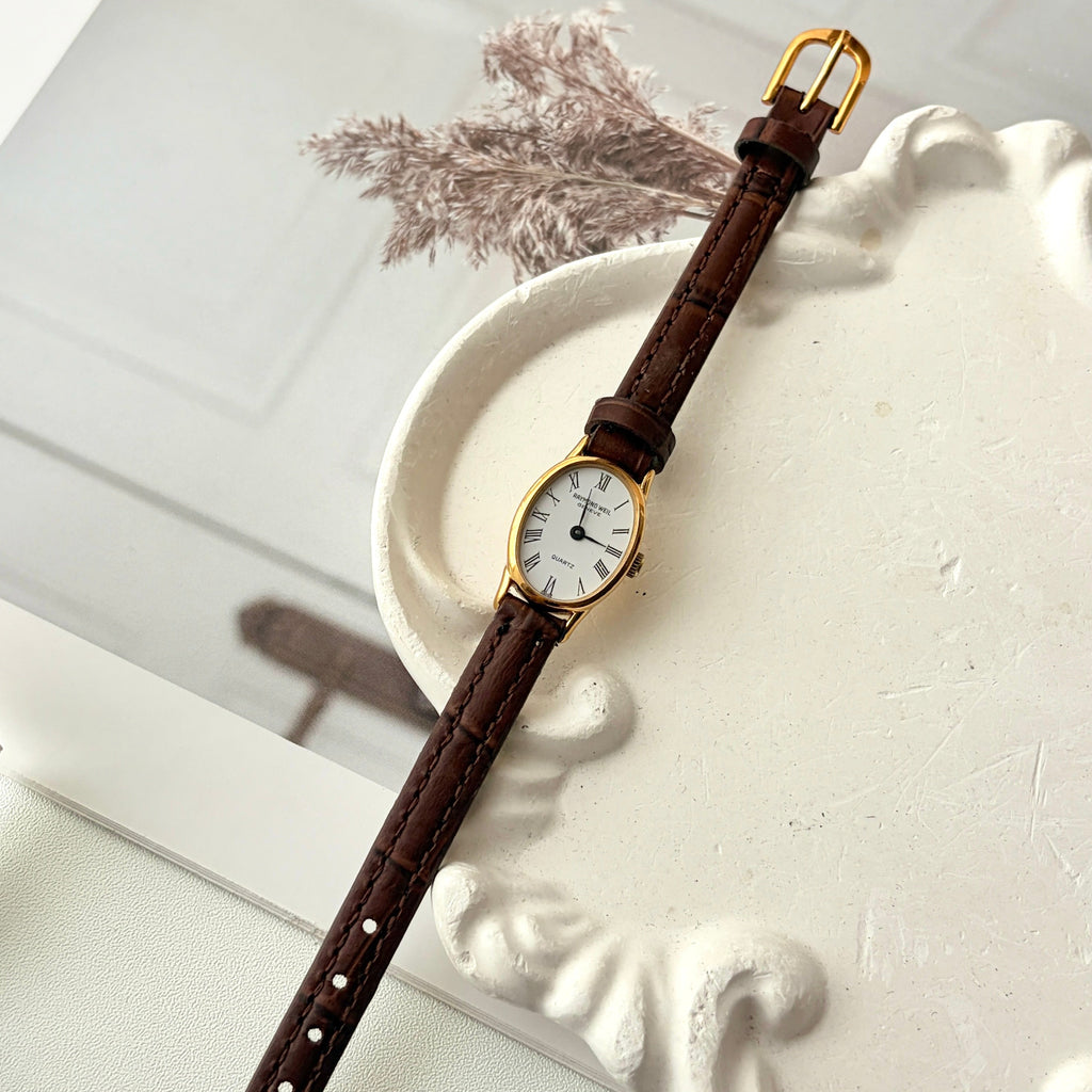 RW. White Oval Dial Brown Strap Watch