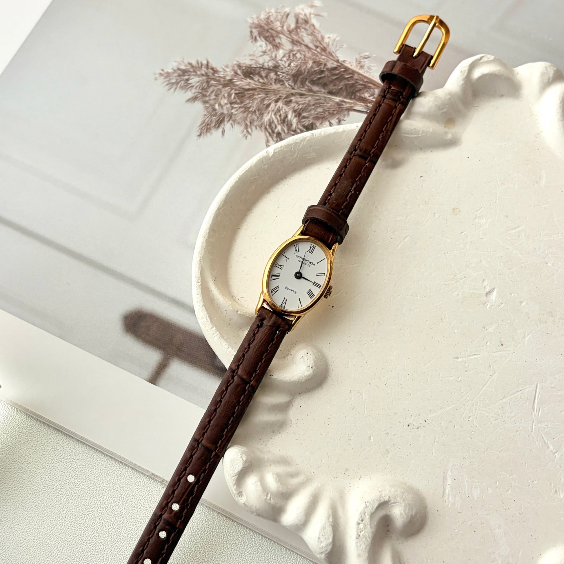 RW. White Oval Dial Brown Strap Watch