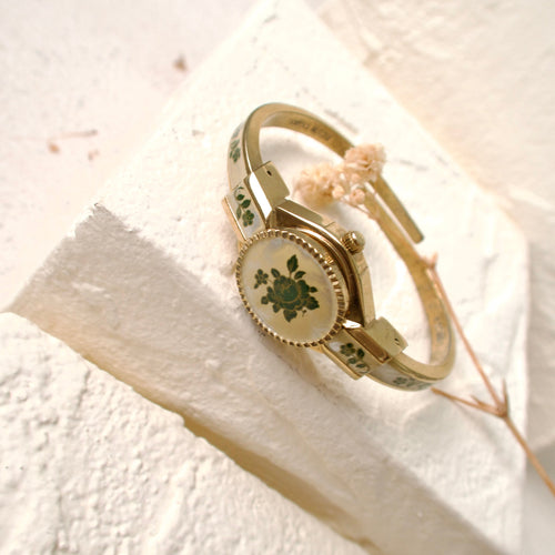 A.M. Beige Blue Floral Pattern Gold Bangle Watch