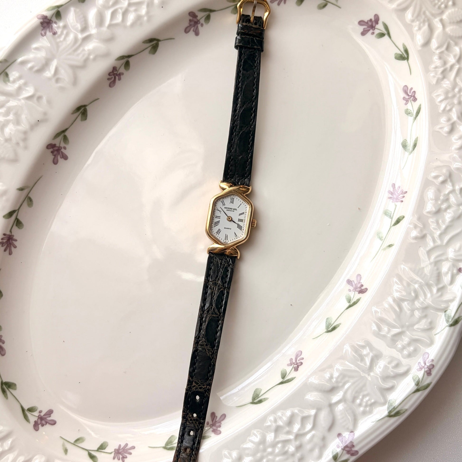 RW. Geneve White Hexagon Roman Dial Black Strap Watch