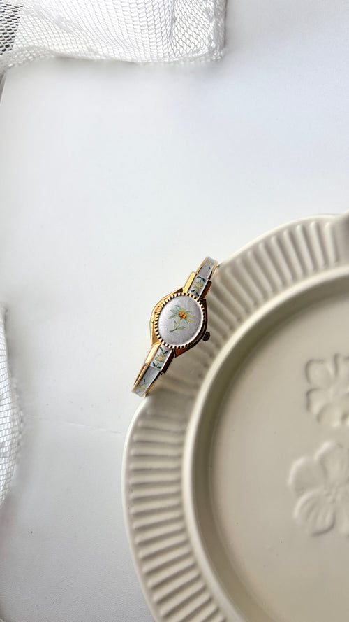 AM. Beige Green Flower Oval Dial with Gold Bangle Watch