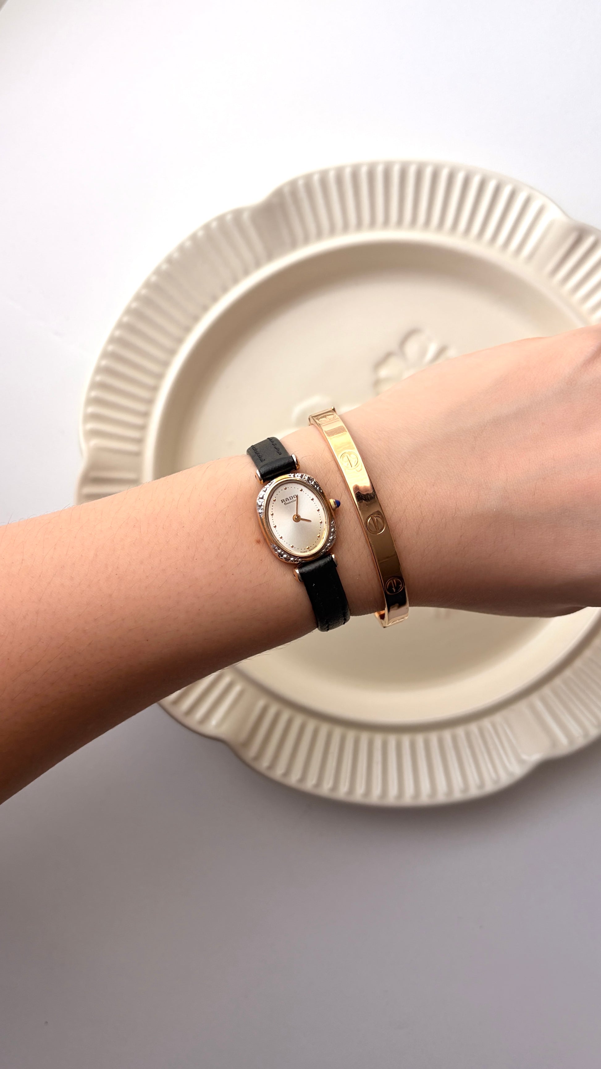 Rd. Gold Oval White Jewel Dial with Black Strap Watch