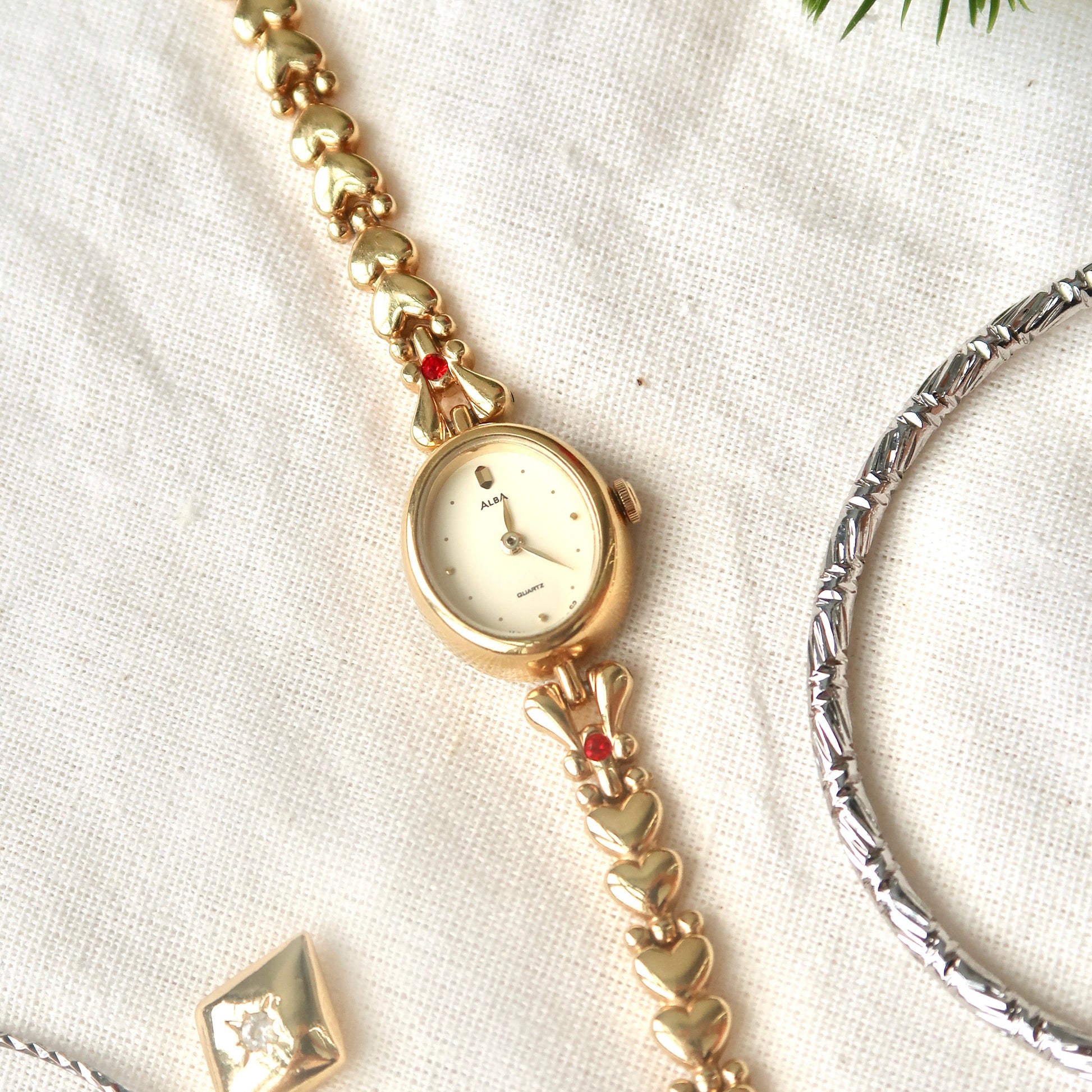S. Alba Gold Dial Red Jewel Chain Watch