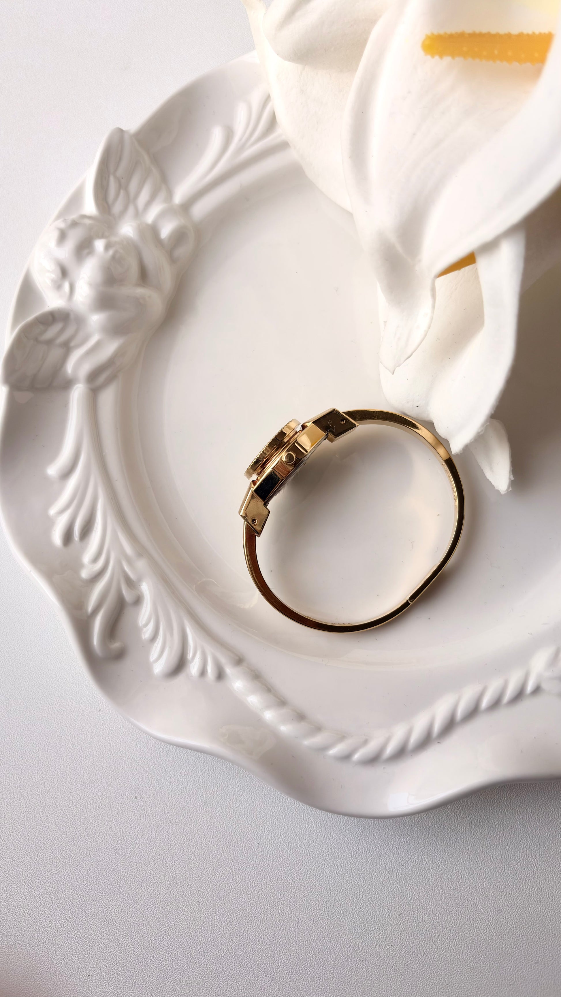 AM. White Blue Flower Case Gold Bangle Watch