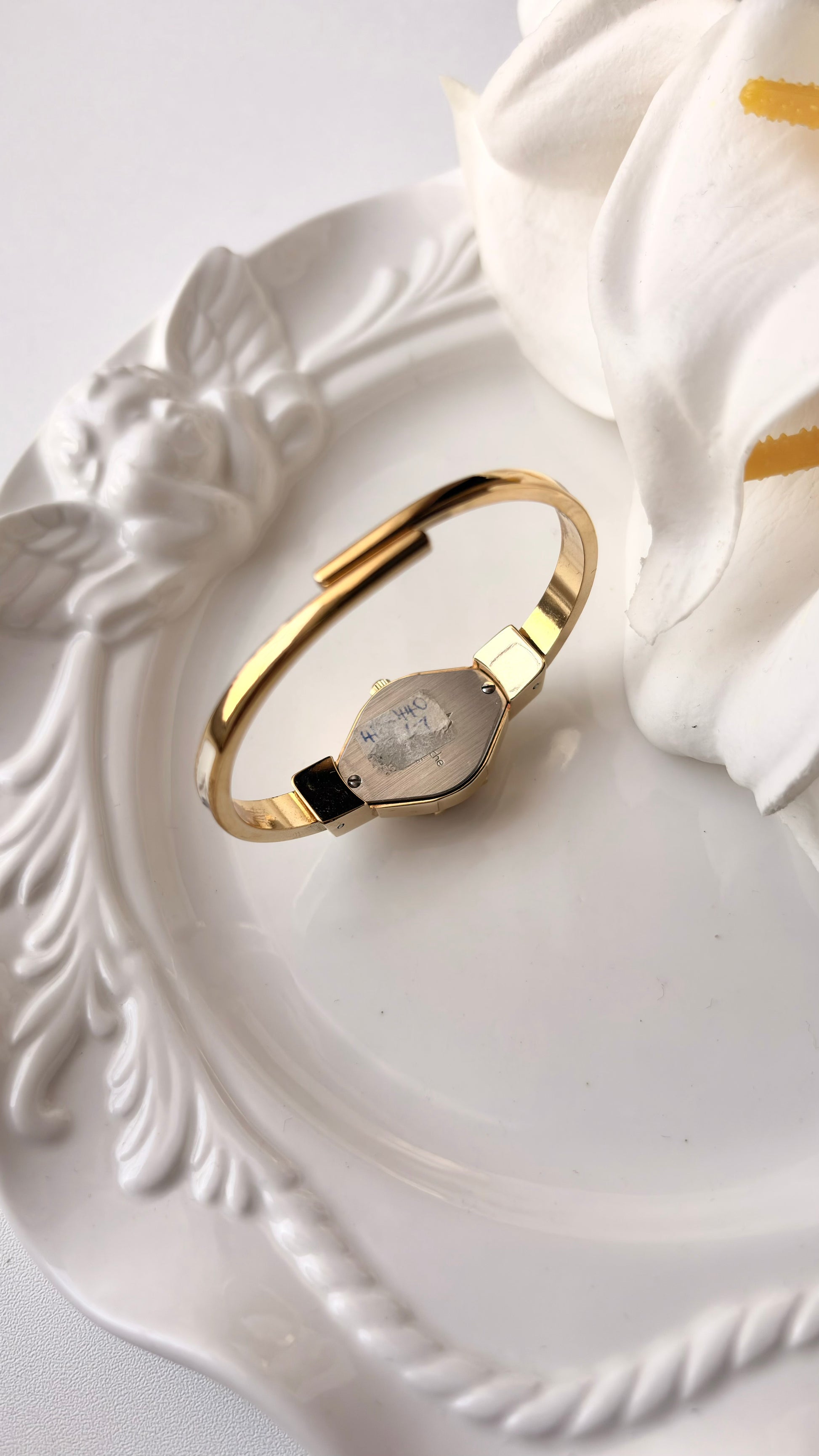 AM. White Blue Flower Case Gold Bangle Watch