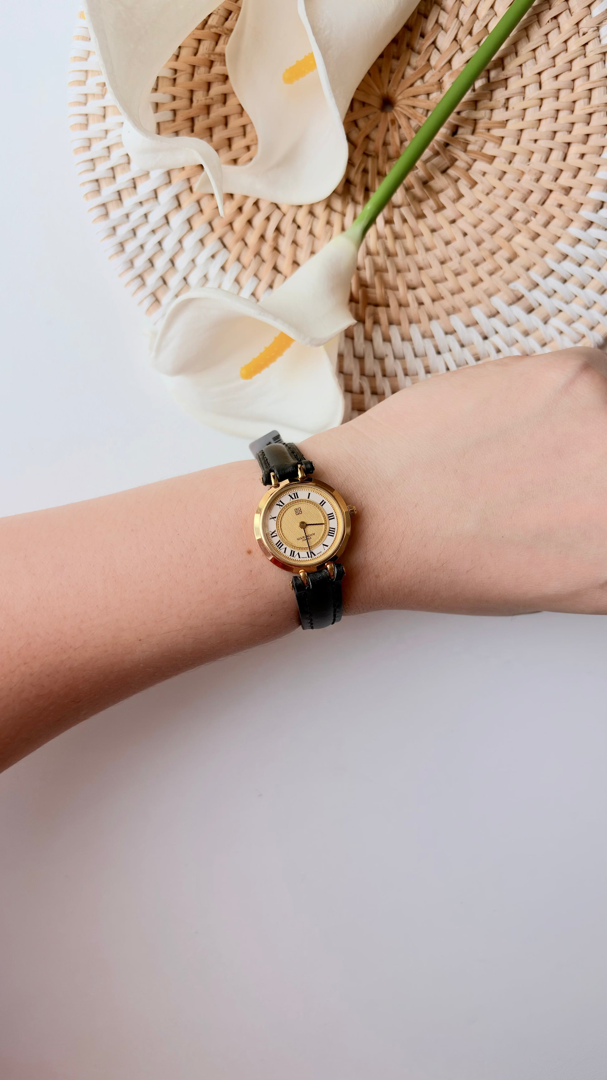 GV. White Gold Round Roman Dial Black Strap Watch