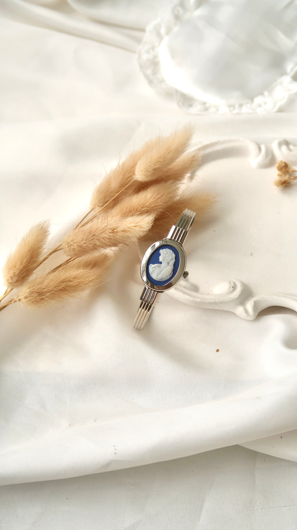 A.M. White Blue Sculpture Silver Bangle Watch