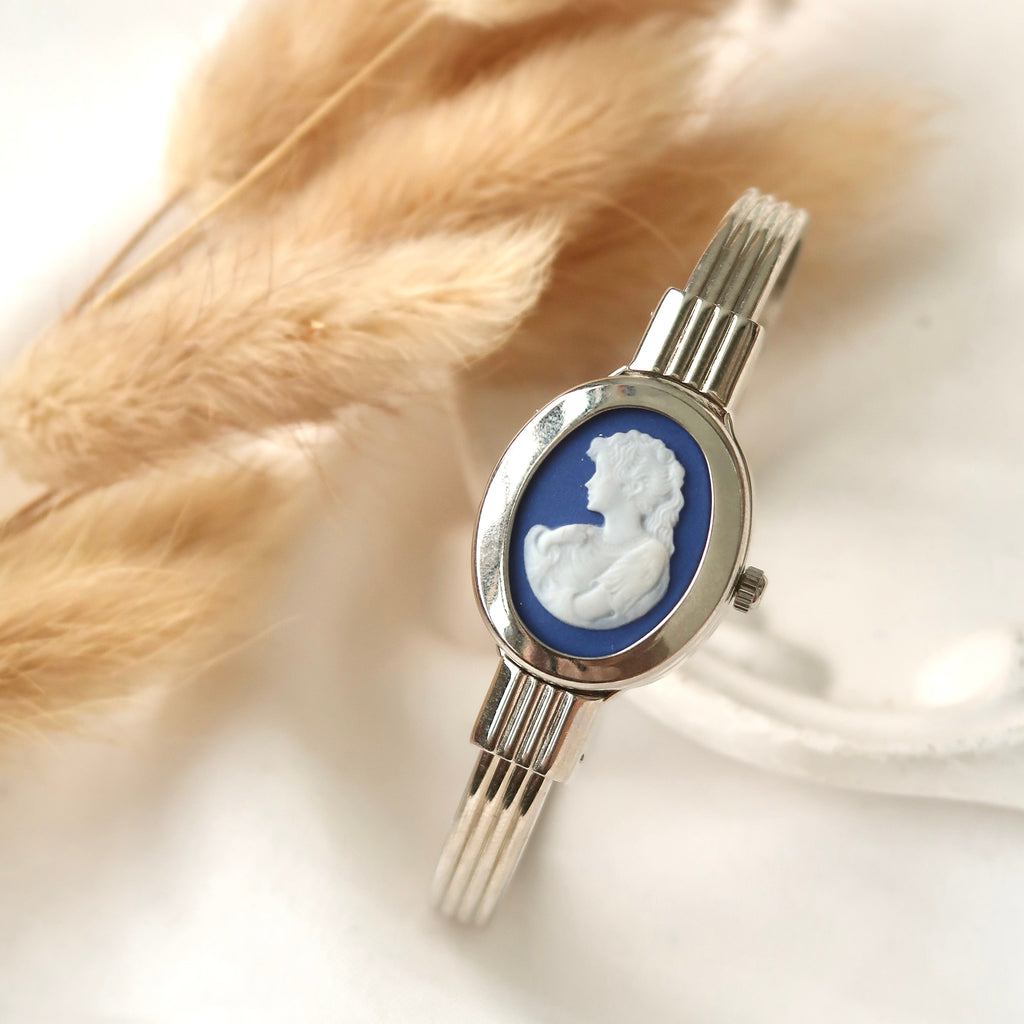 A.M. White Blue Sculpture Silver Bangle Watch