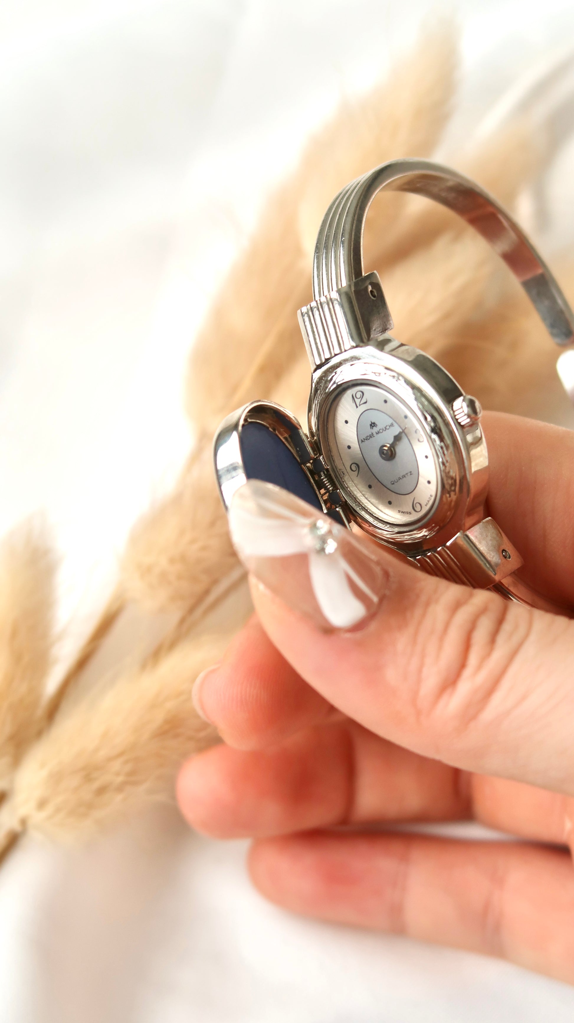 A.M. White Blue Sculpture Silver Bangle Watch