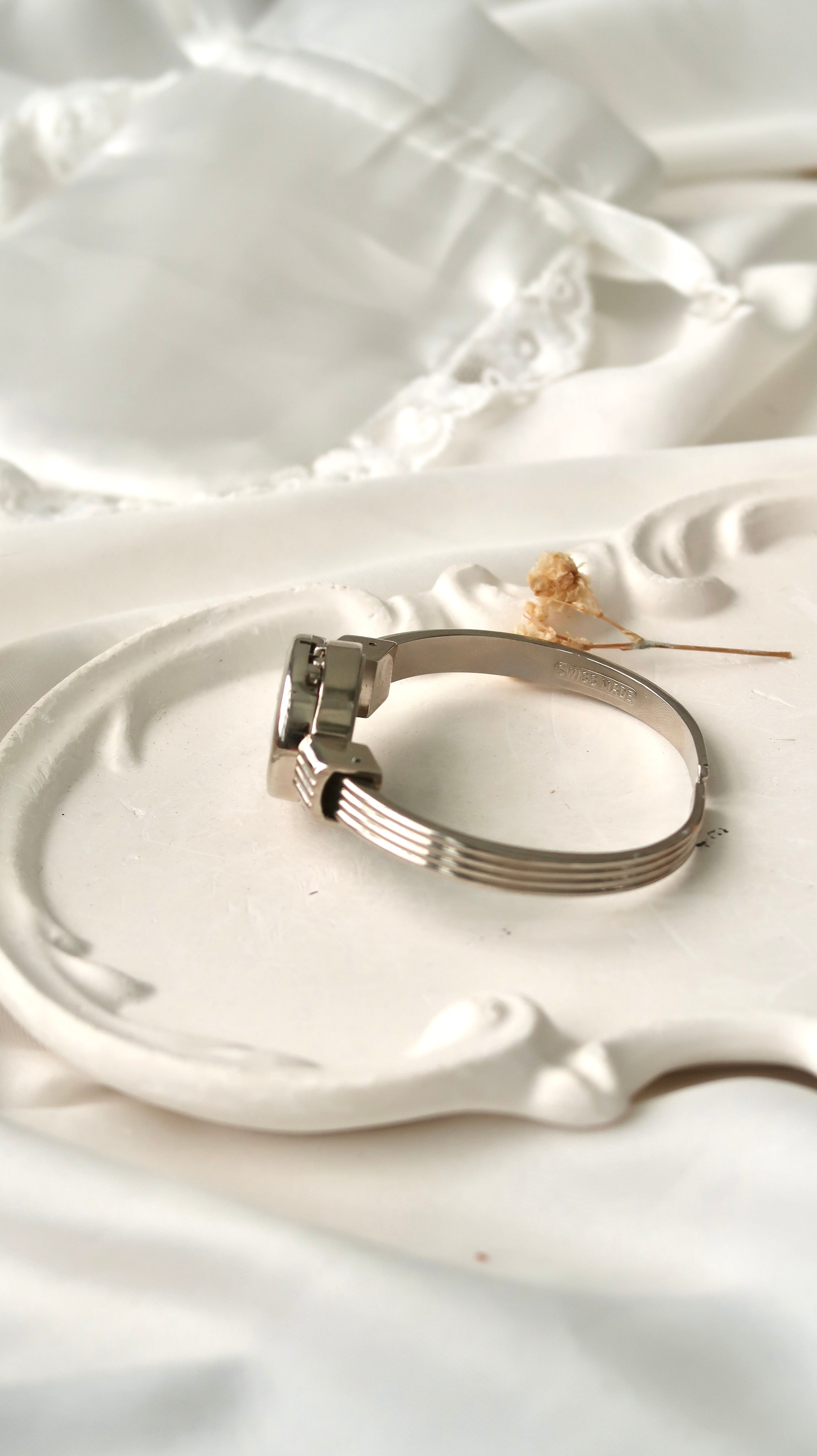 A.M. White Blue Sculpture Silver Bangle Watch