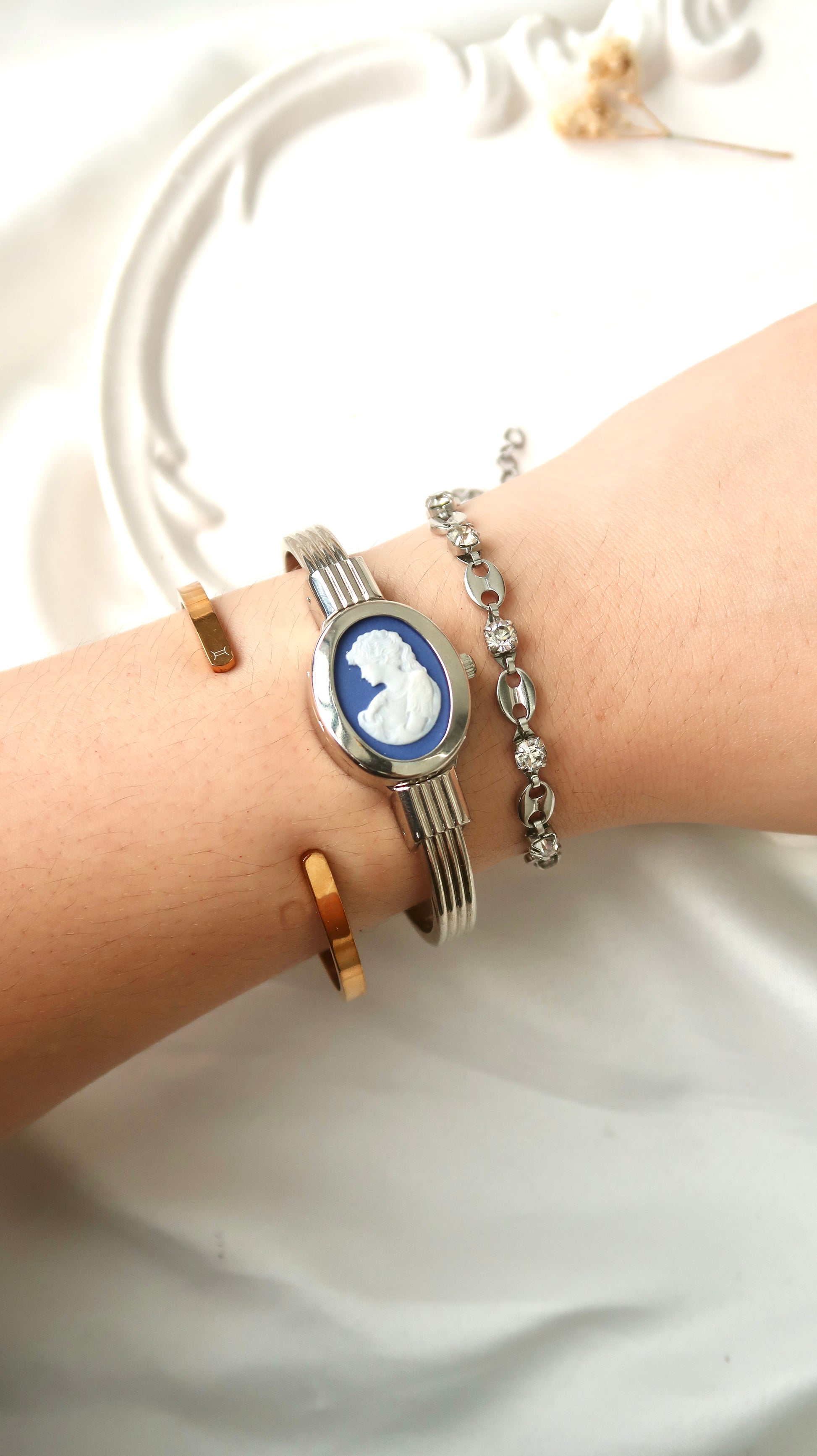 A.M. White Blue Sculpture Silver Bangle Watch