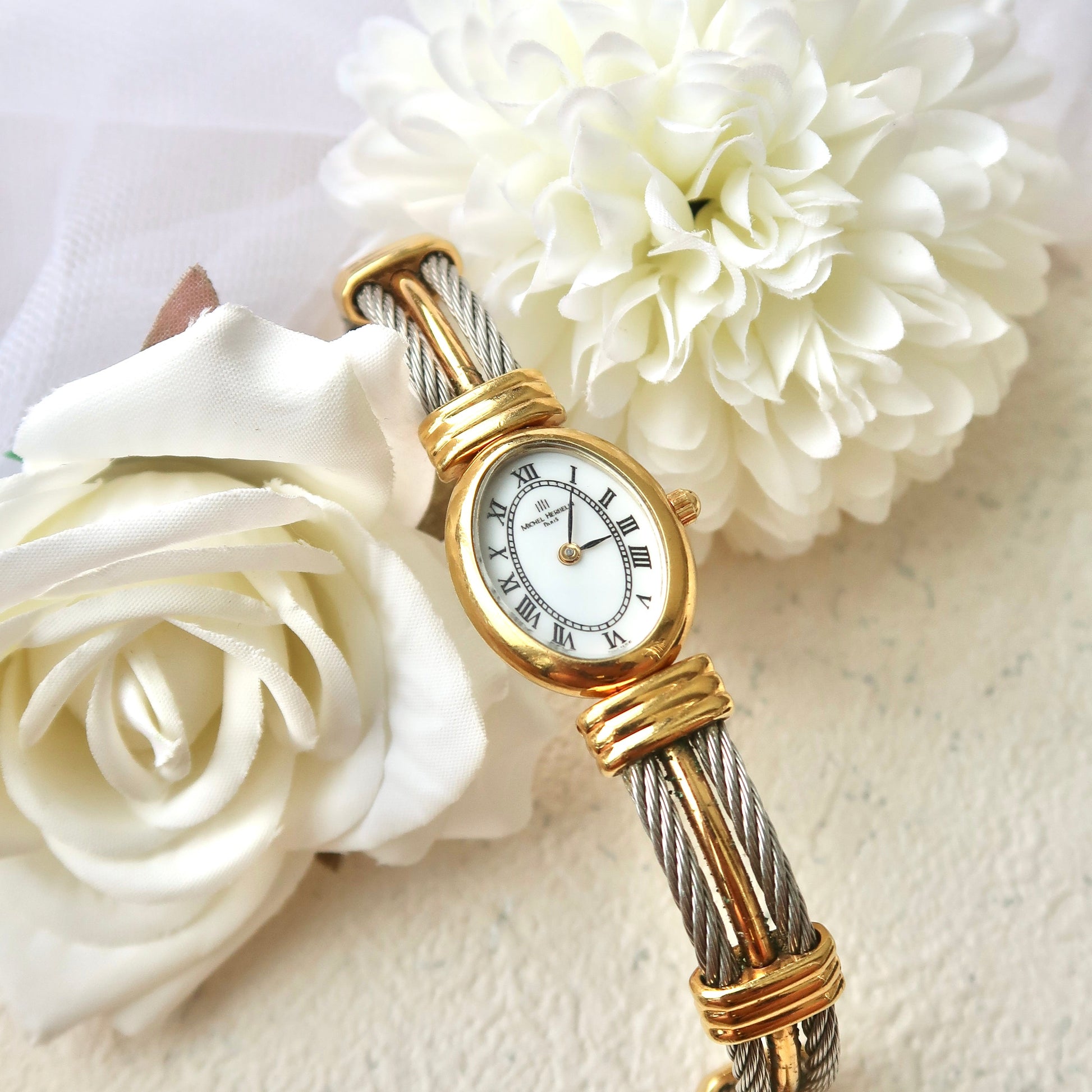 M. Herbelin White Oval Roman Dial with Two Tone Bangle Watch
