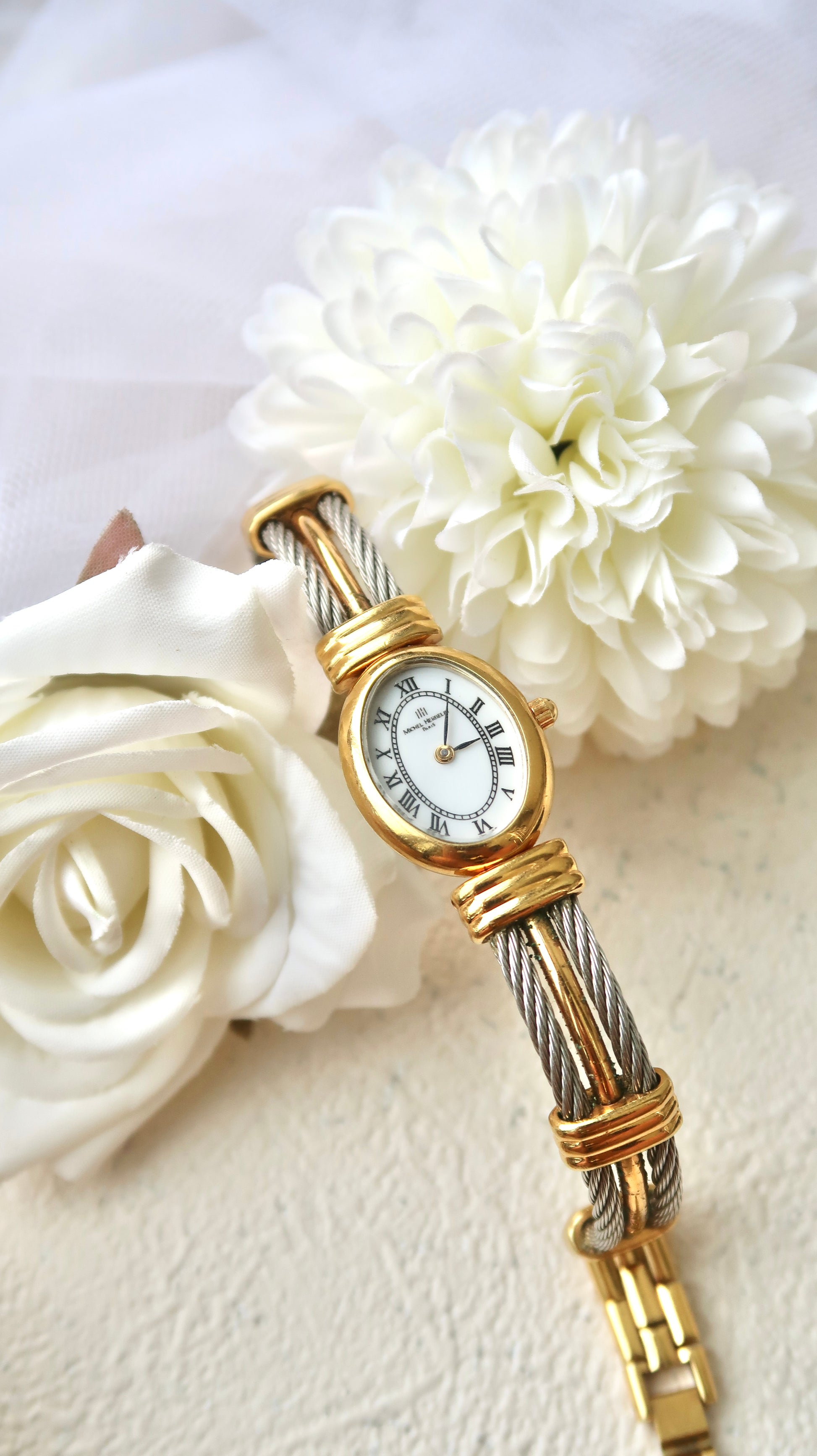 M. Herbelin White Oval Roman Dial with Two Tone Bangle Watch