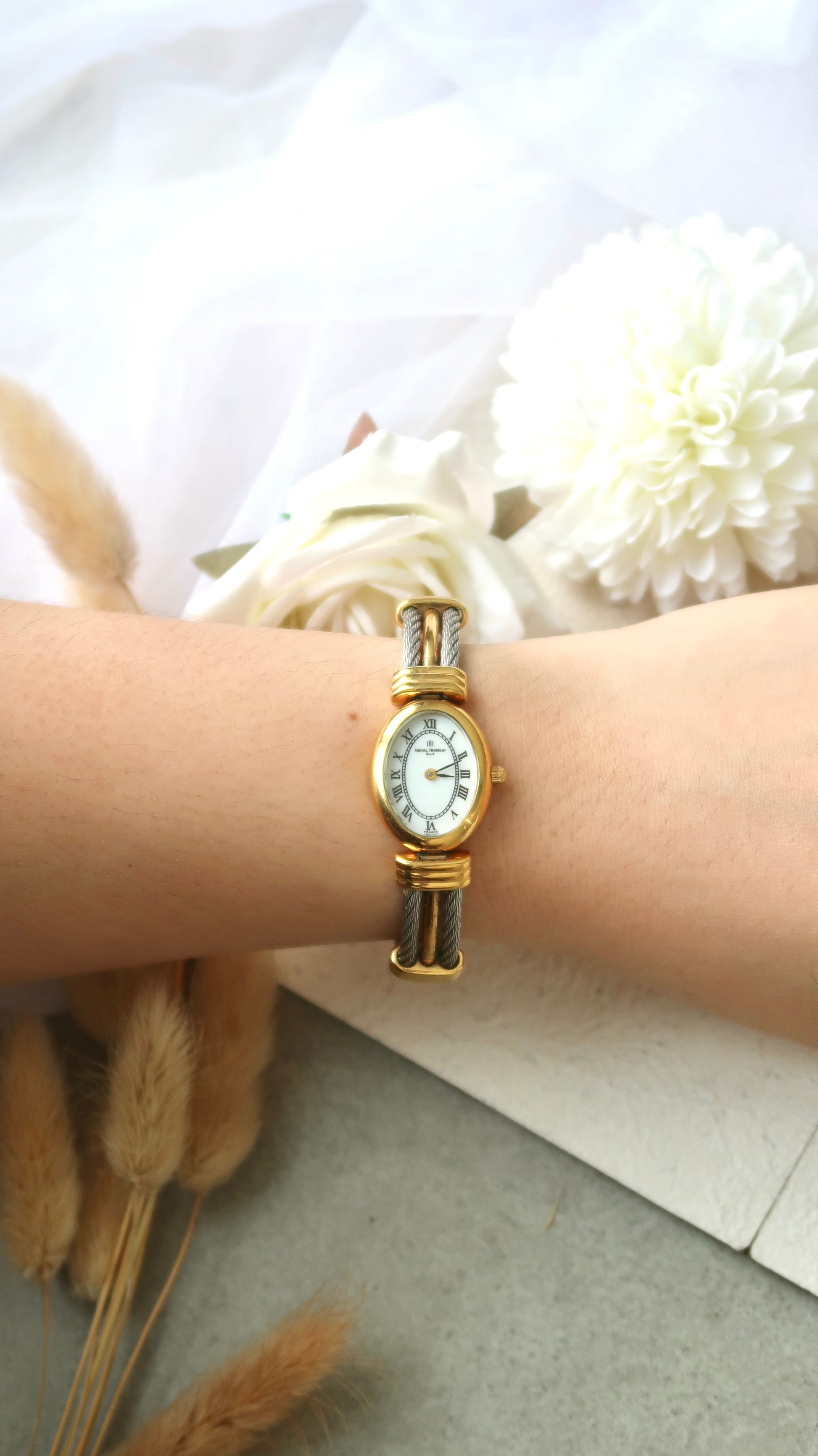 M. Herbelin White Oval Roman Dial with Two Tone Bangle Watch