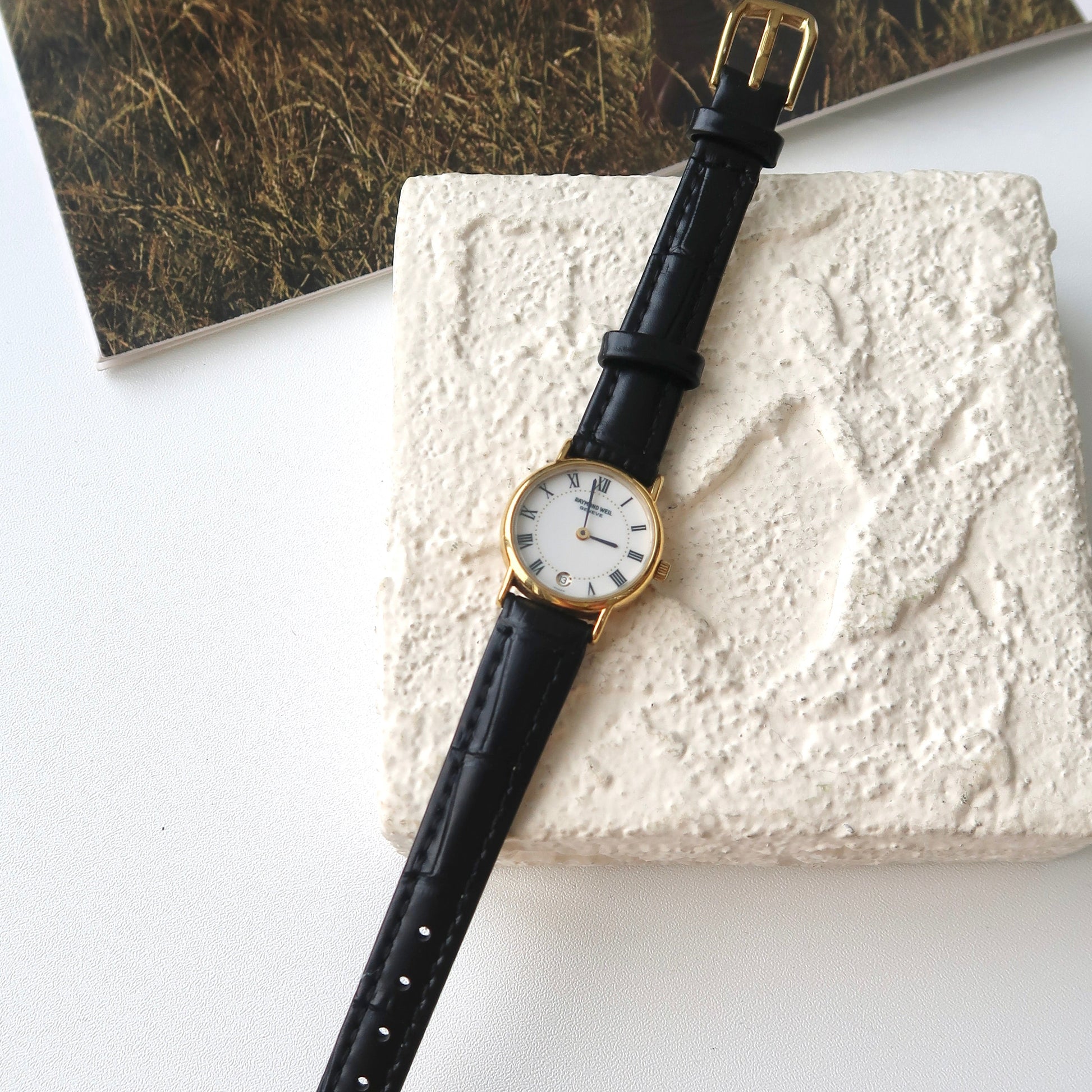 RW. Round White Roman Date Dial with Black Strap Watch