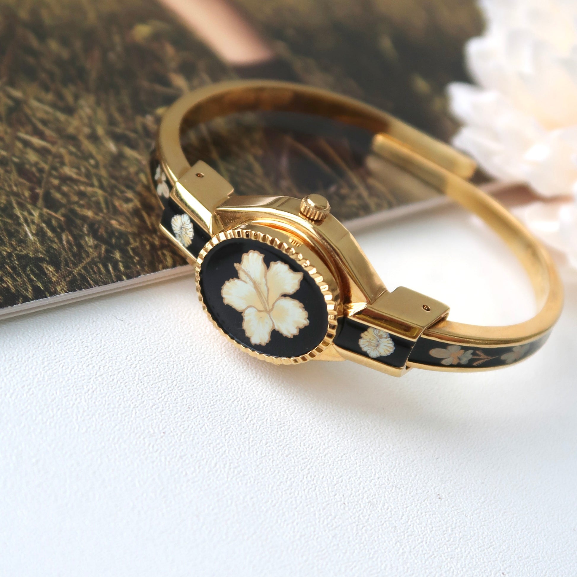 AM. White Hibiscus Flower Black Pattern Gold Bangle Watch