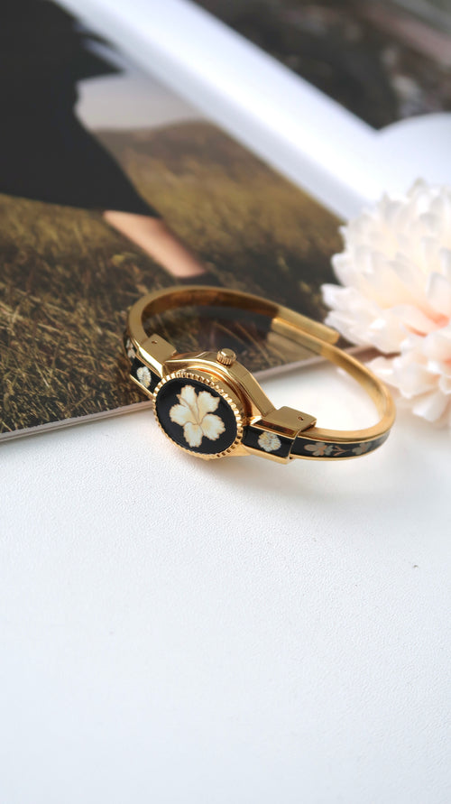 AM. White Hibiscus Flower Black Pattern Gold Bangle Watch