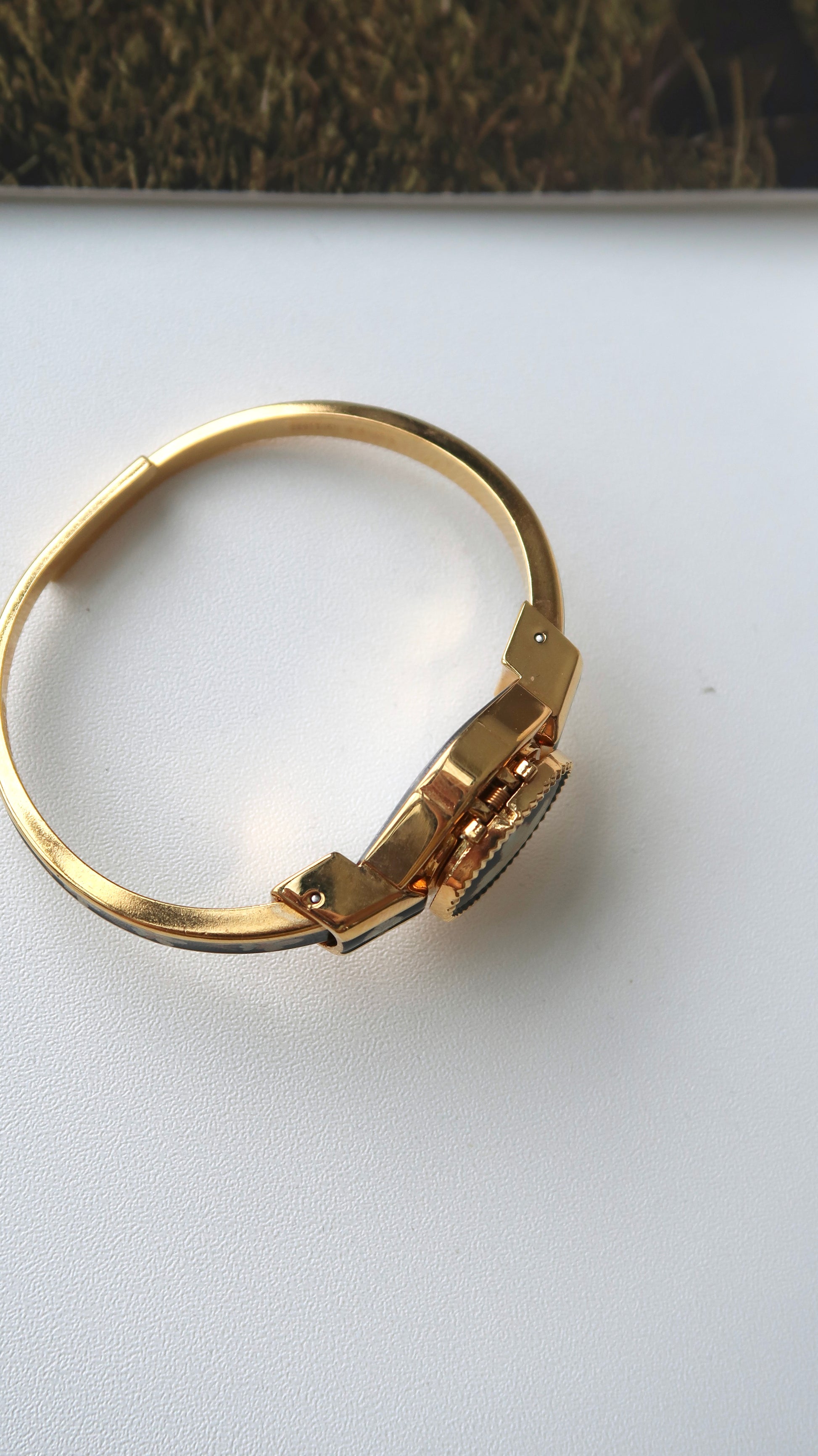 AM. White Hibiscus Flower Black Pattern Gold Bangle Watch