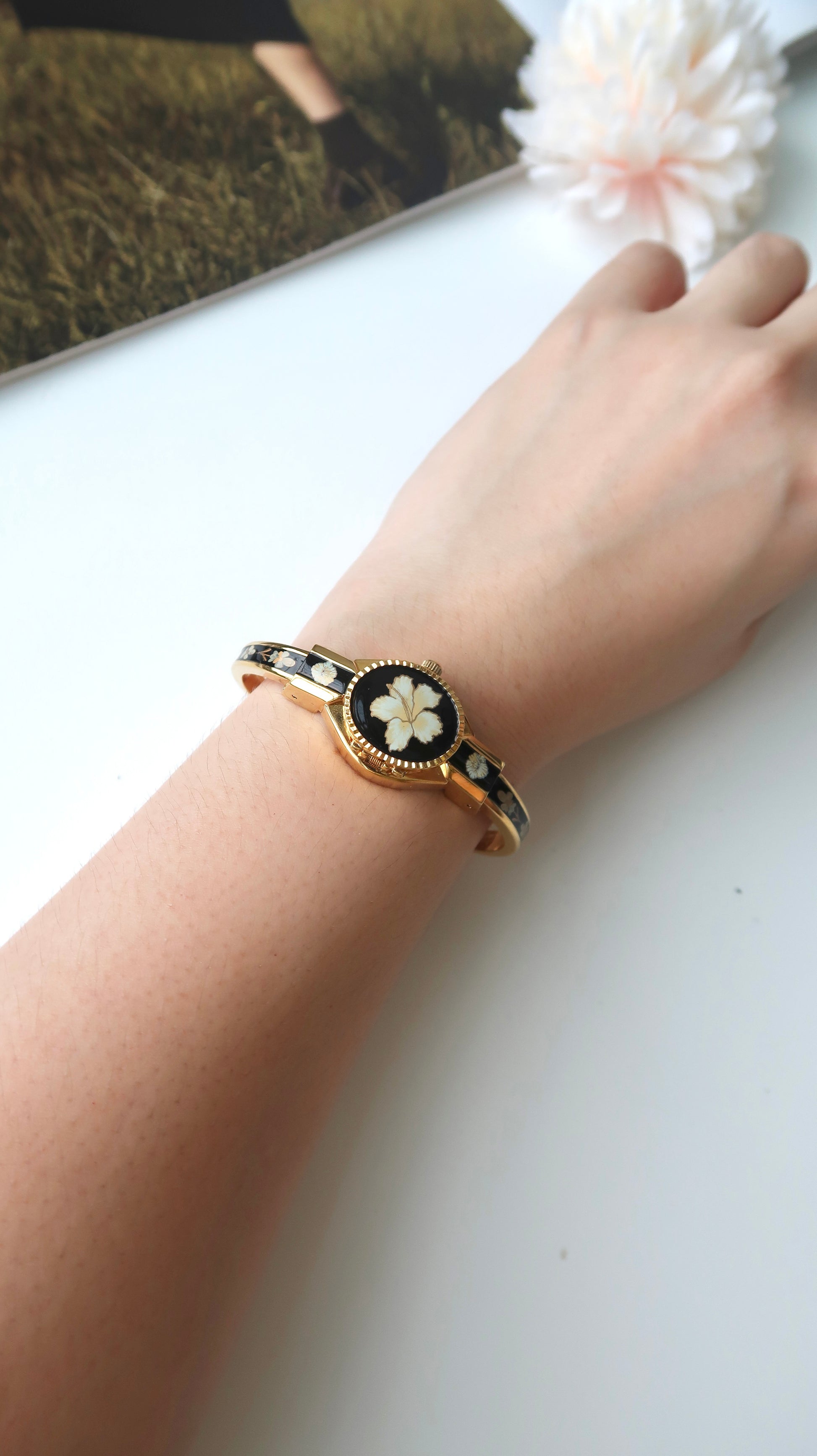 AM. White Hibiscus Flower Black Pattern Gold Bangle Watch