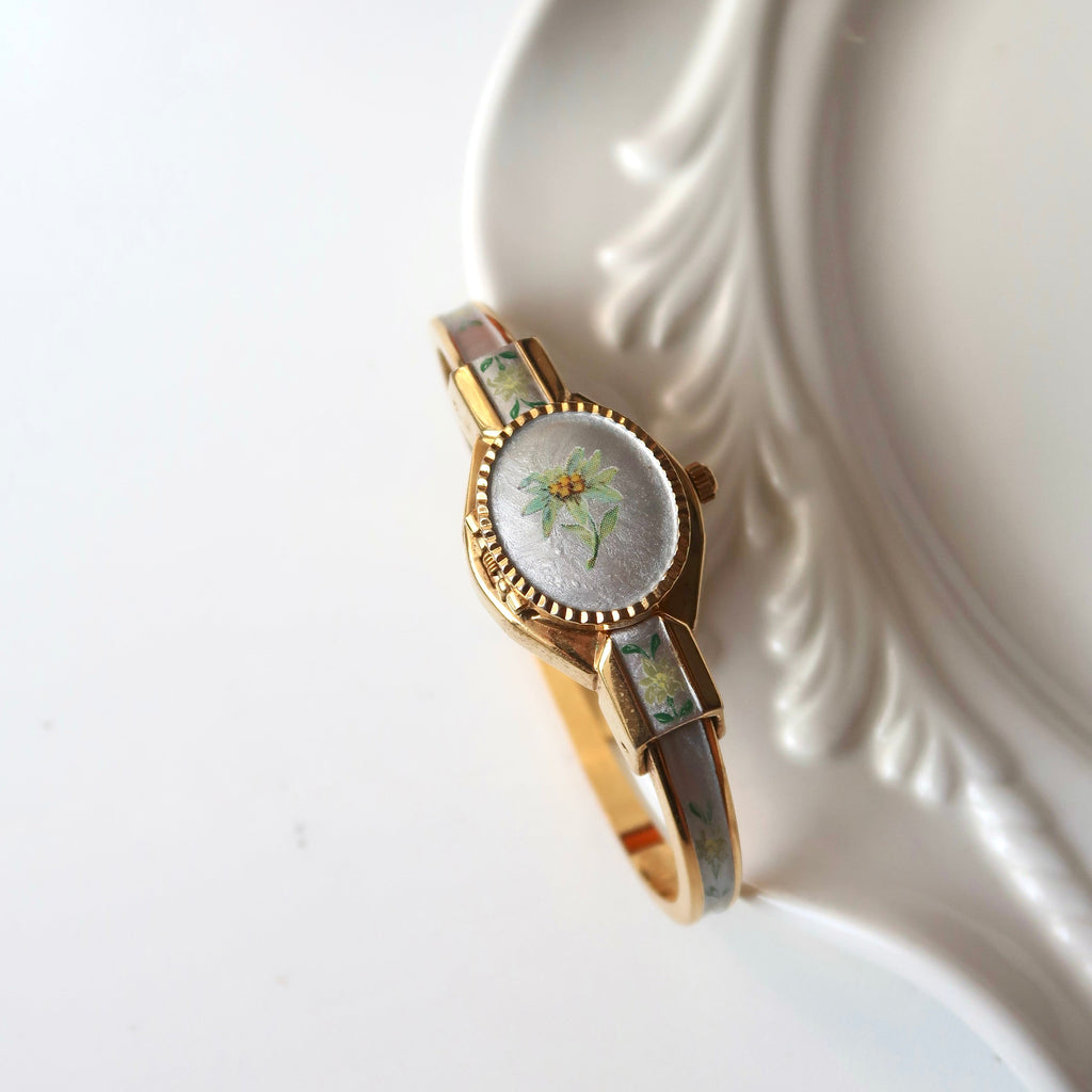 AM. Silver & Green Flower Dial Gold Bangle Watch