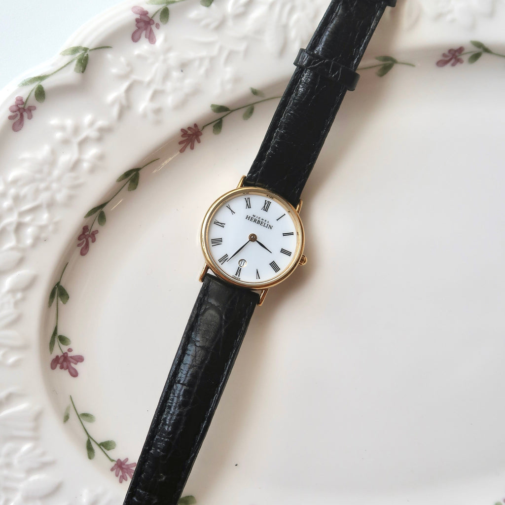 M. Herbelin White Roman Date Round Dial Black Strap Watch