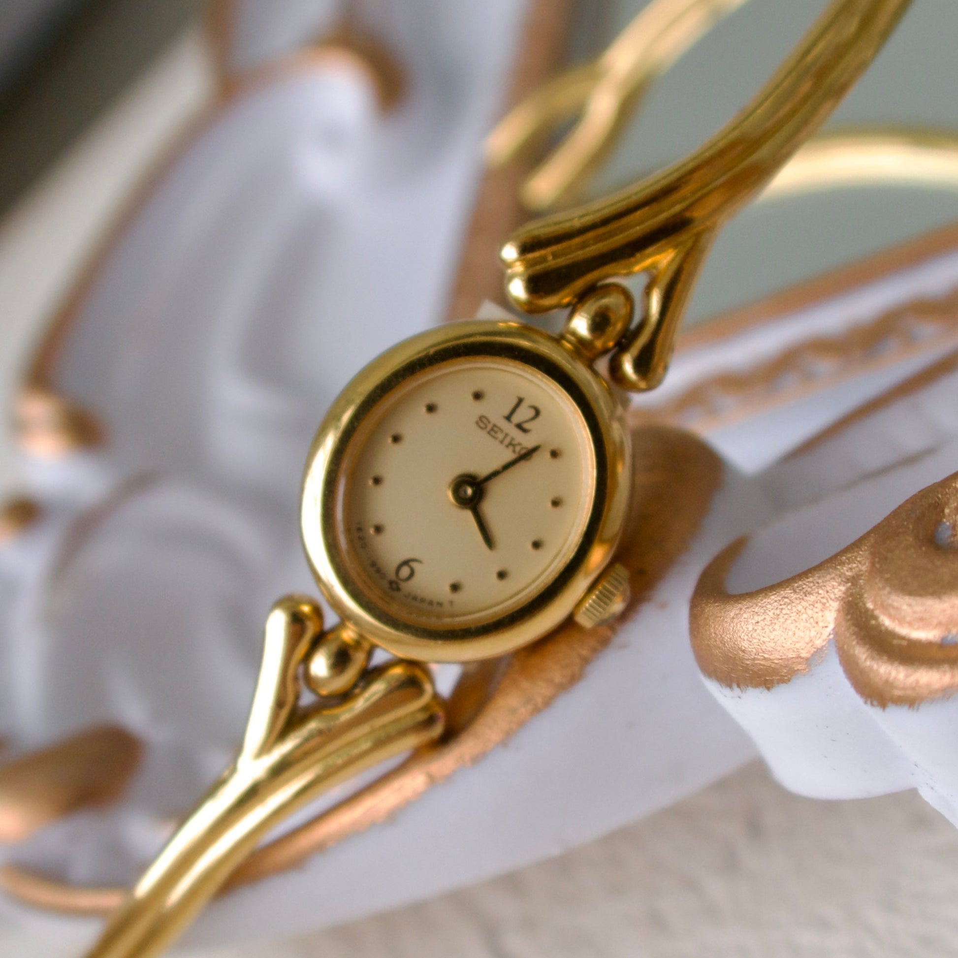 S. Round Gold Dial with Gold Bangle Bracelet