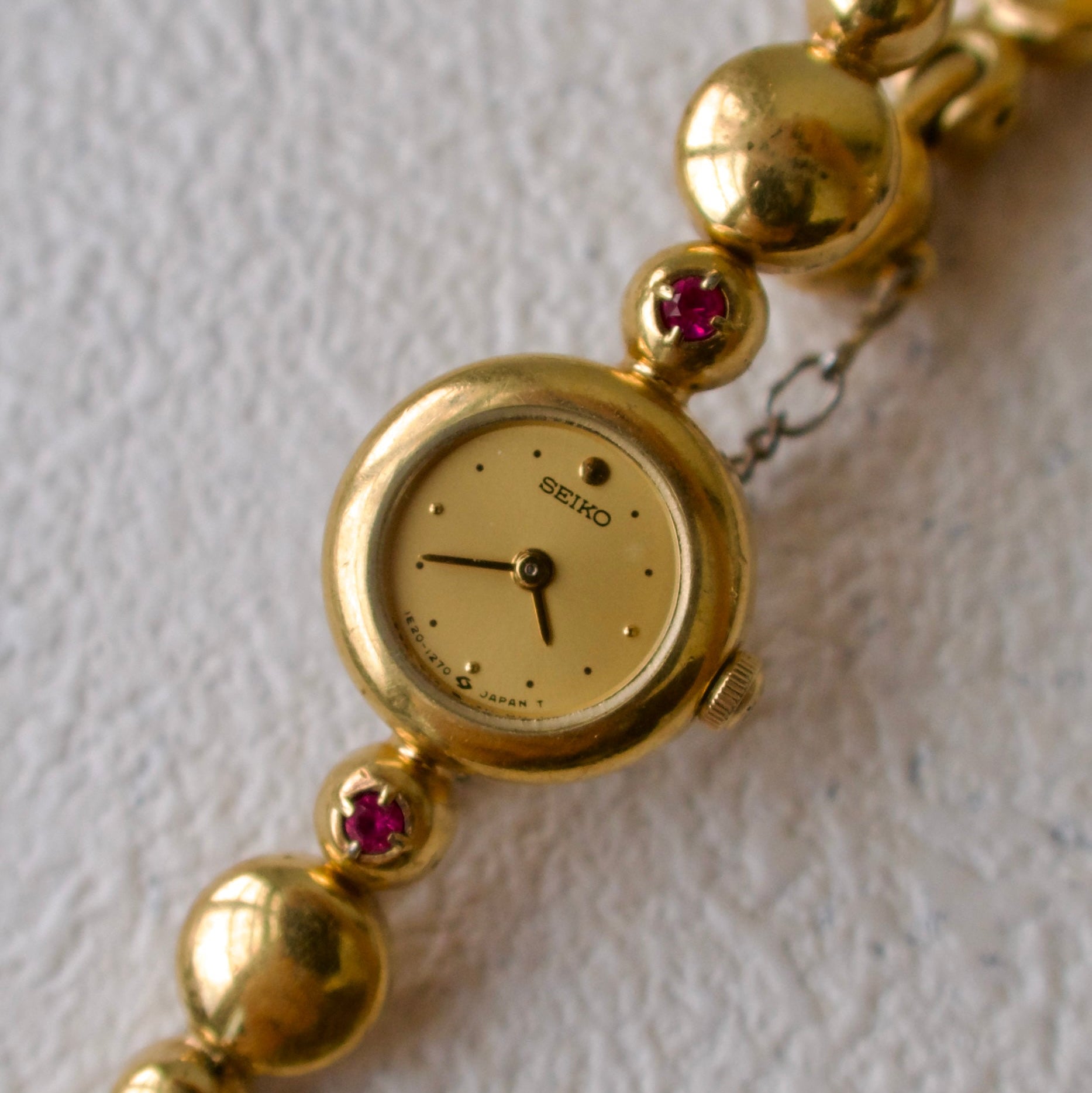 S. Round Gold Dial with Rubies, Beaded Chain
