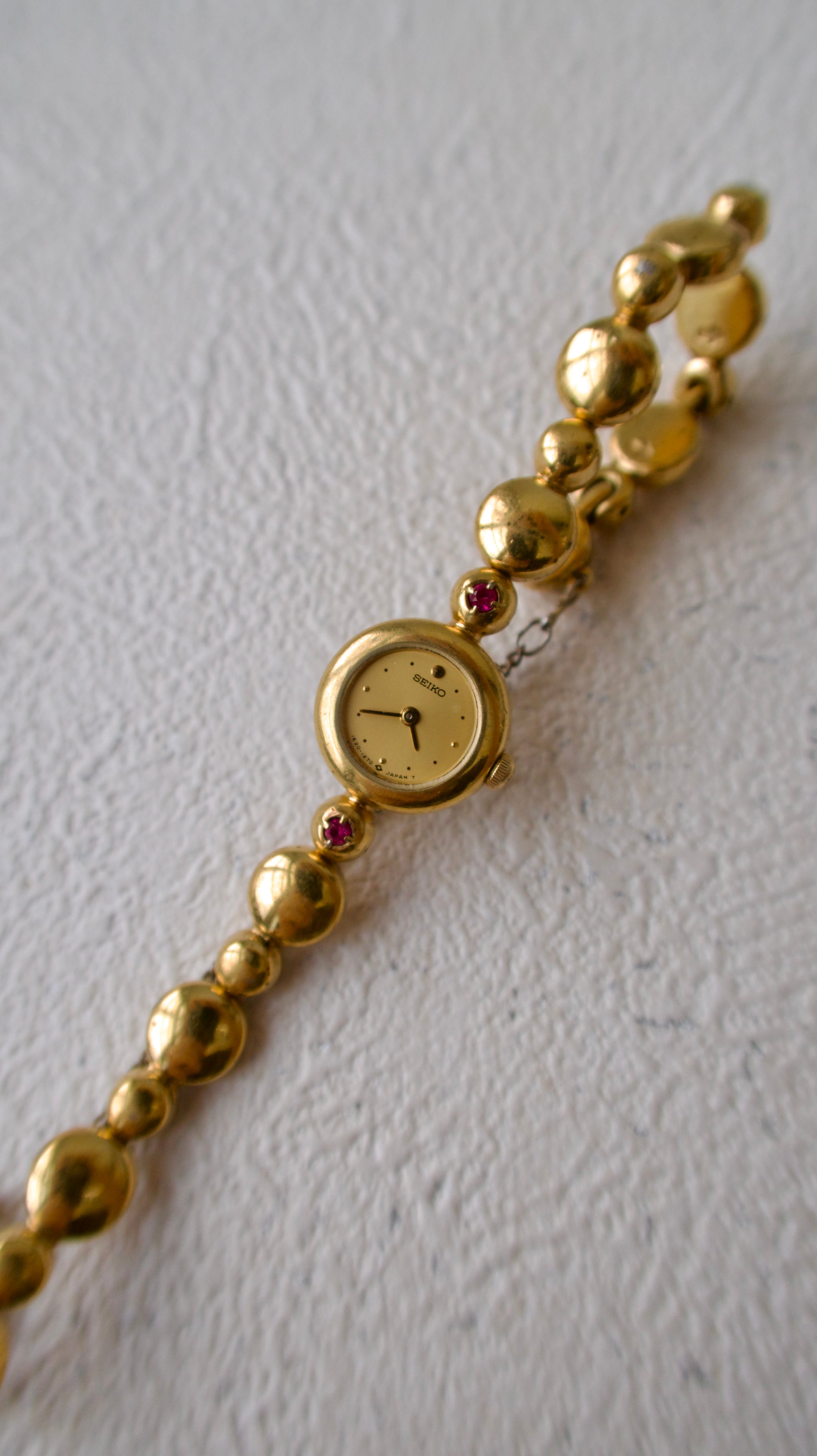 S. Round Gold Dial with Rubies, Beaded Chain