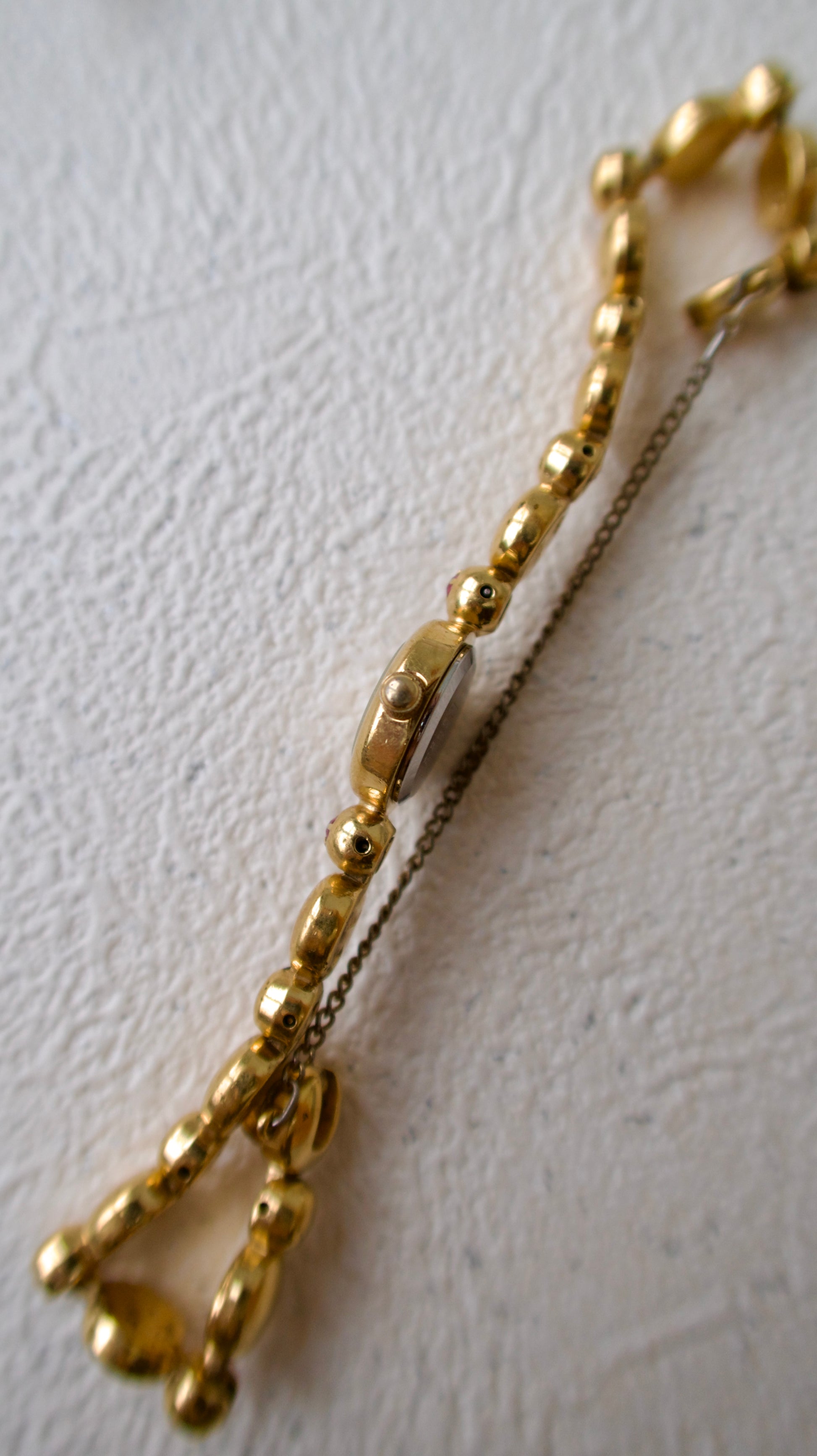 S. Round Gold Dial with Rubies, Beaded Chain