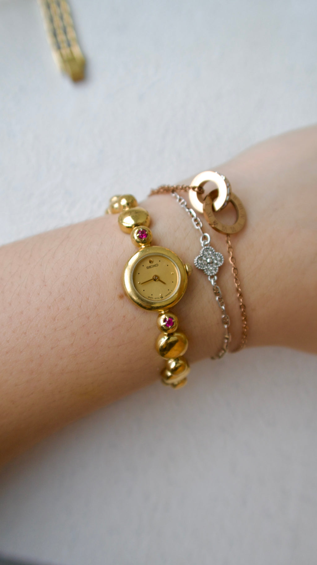 S. Round Gold Dial with Rubies, Beaded Chain