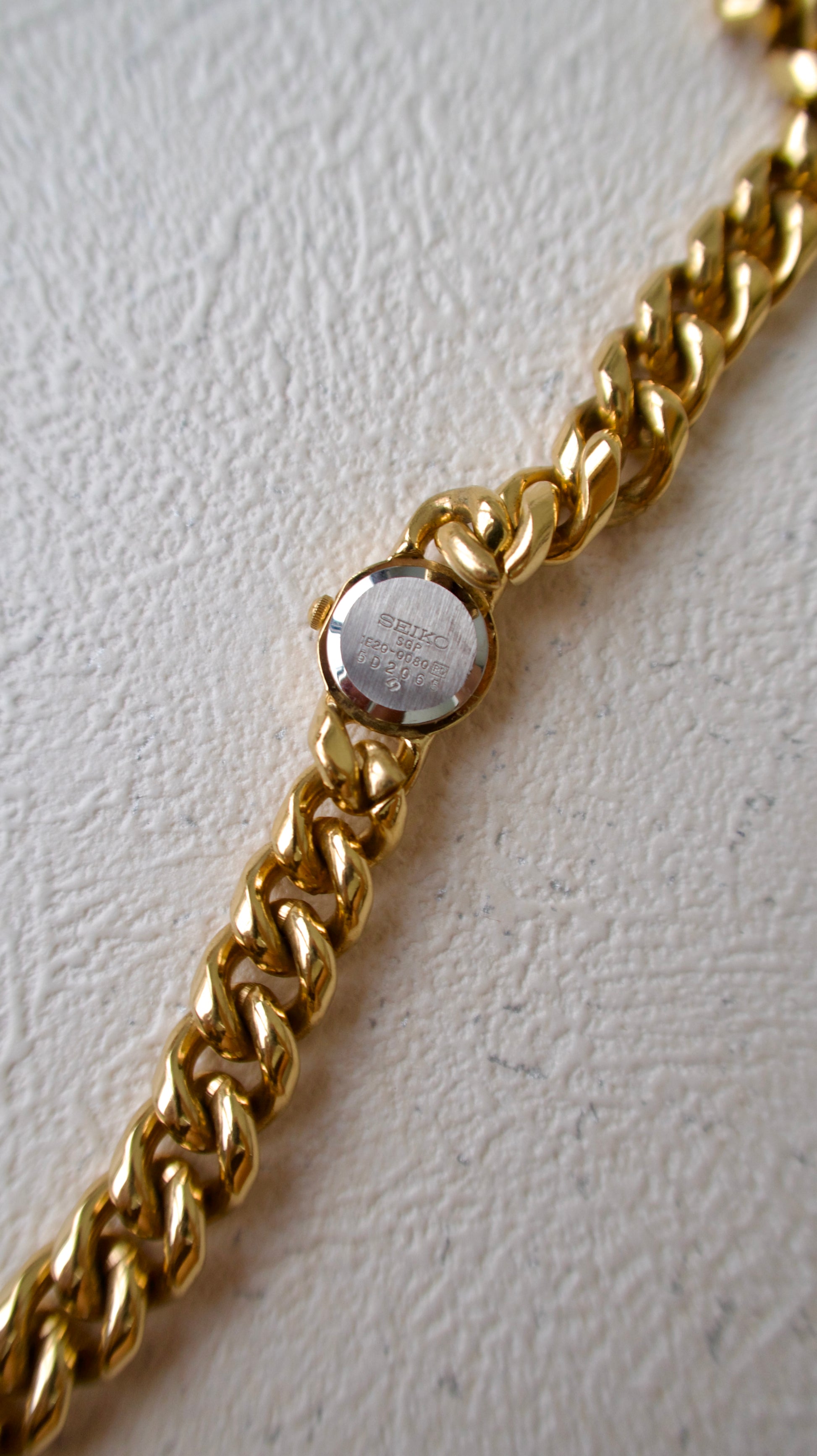 S. Round Gold Dial with Twist Chain