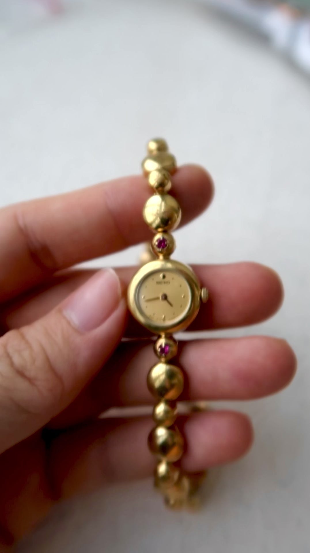 S. Round Gold Dial with Rubies, Beaded Chain