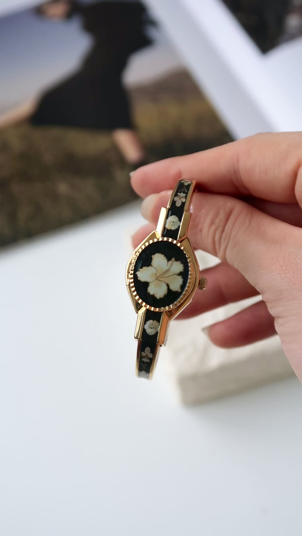 AM. White Hibiscus Flower Black Pattern Gold Bangle Watch