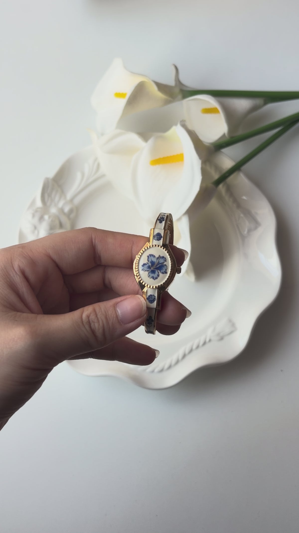 AM. White Blue Flower Case Gold Bangle Watch